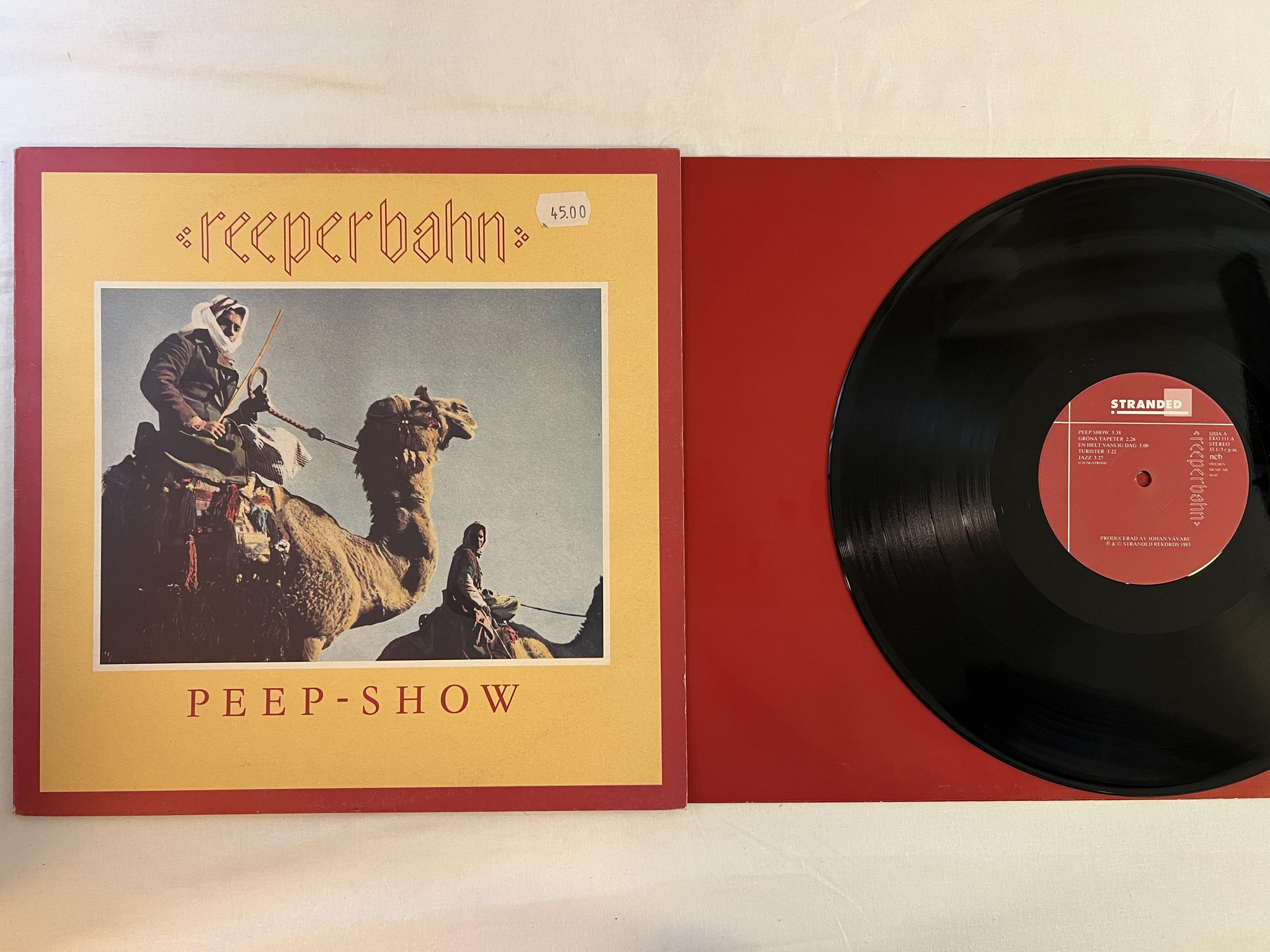 Omslagsbild för skivan REEPERBAHN peep show LP -83 Swe STRANDED EKO 111