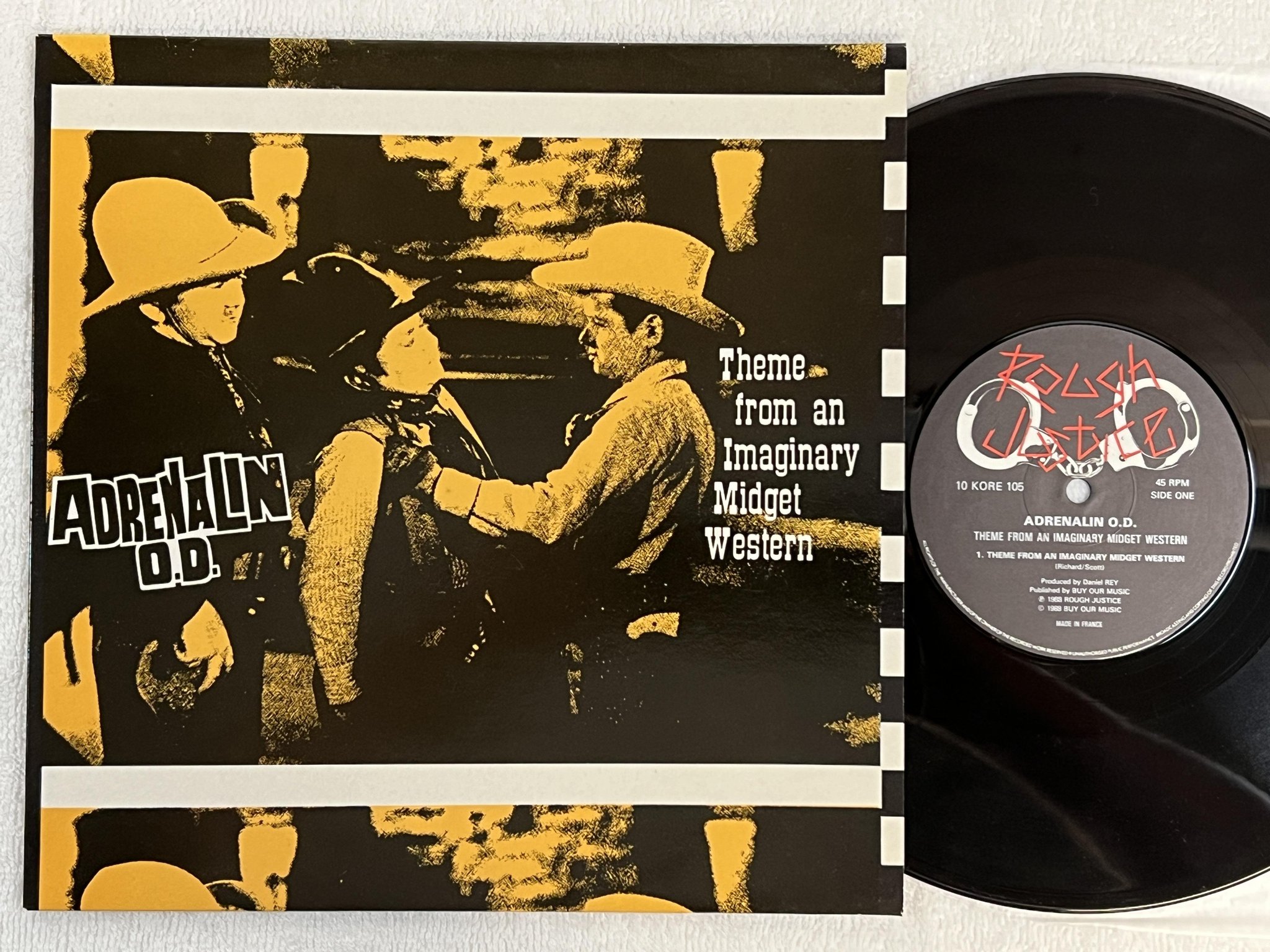 Omslagsbild för skivan ADRENALIN O.D. Theme From An Imaginary Midget Western 10" -88 10 KORE 105