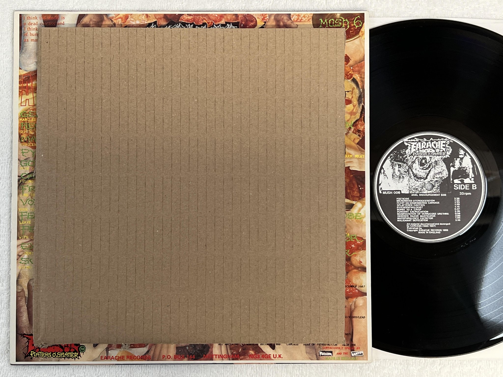 Omslagsbild för skivan CARCASS Reek Of Putrefaction LP -88 UK EARACHE Mosh 25