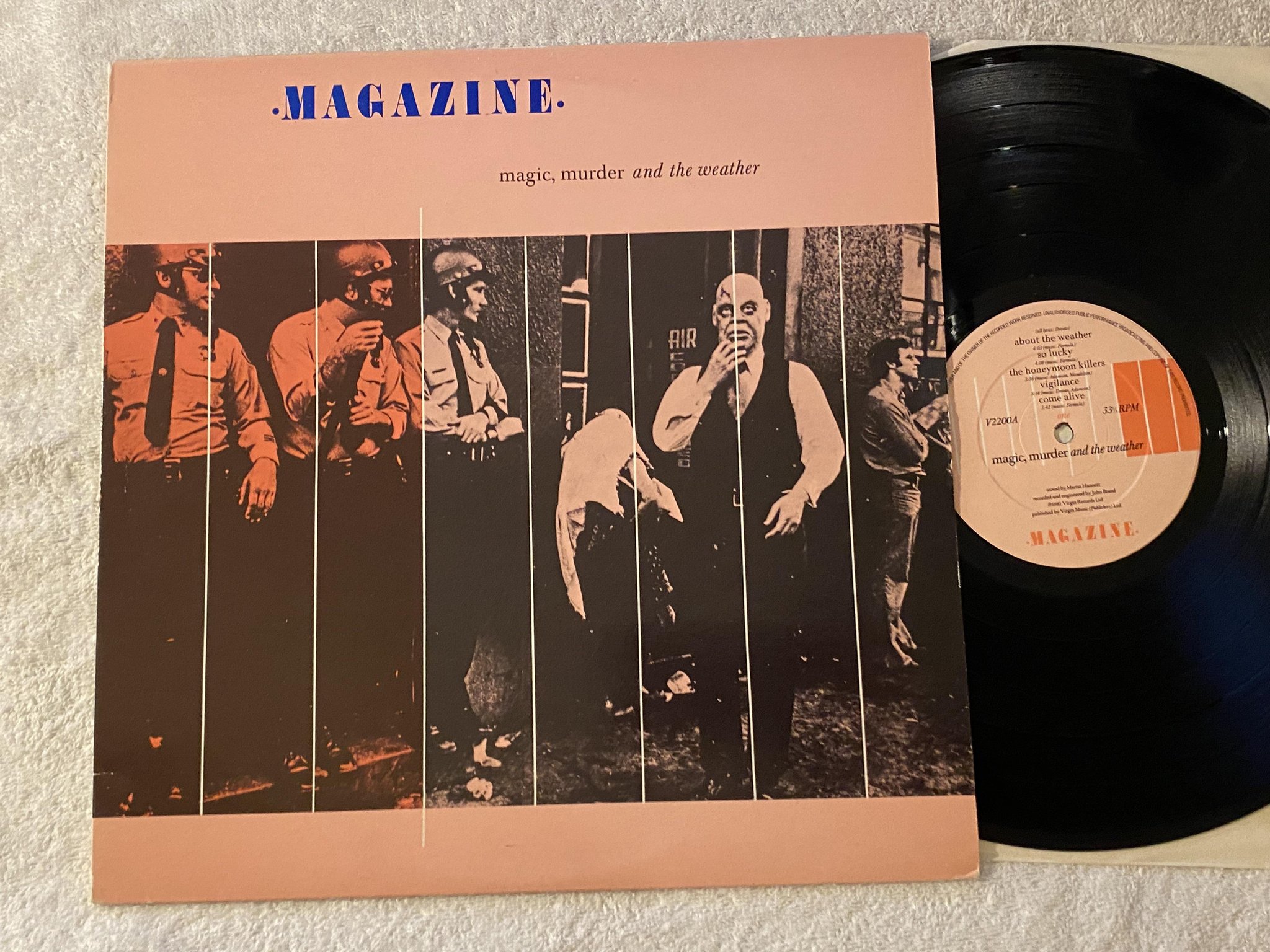 Omslagsbild för skivan MAGAZINE magic, murder and the weather LP -81 VIRGIN V2200