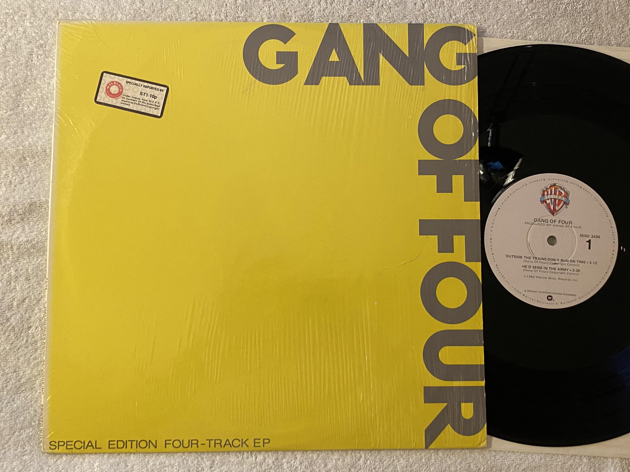 Omslagsbild för skivan GANG OF FOUR s/t 12"ep -80 US WARNER mini 3494