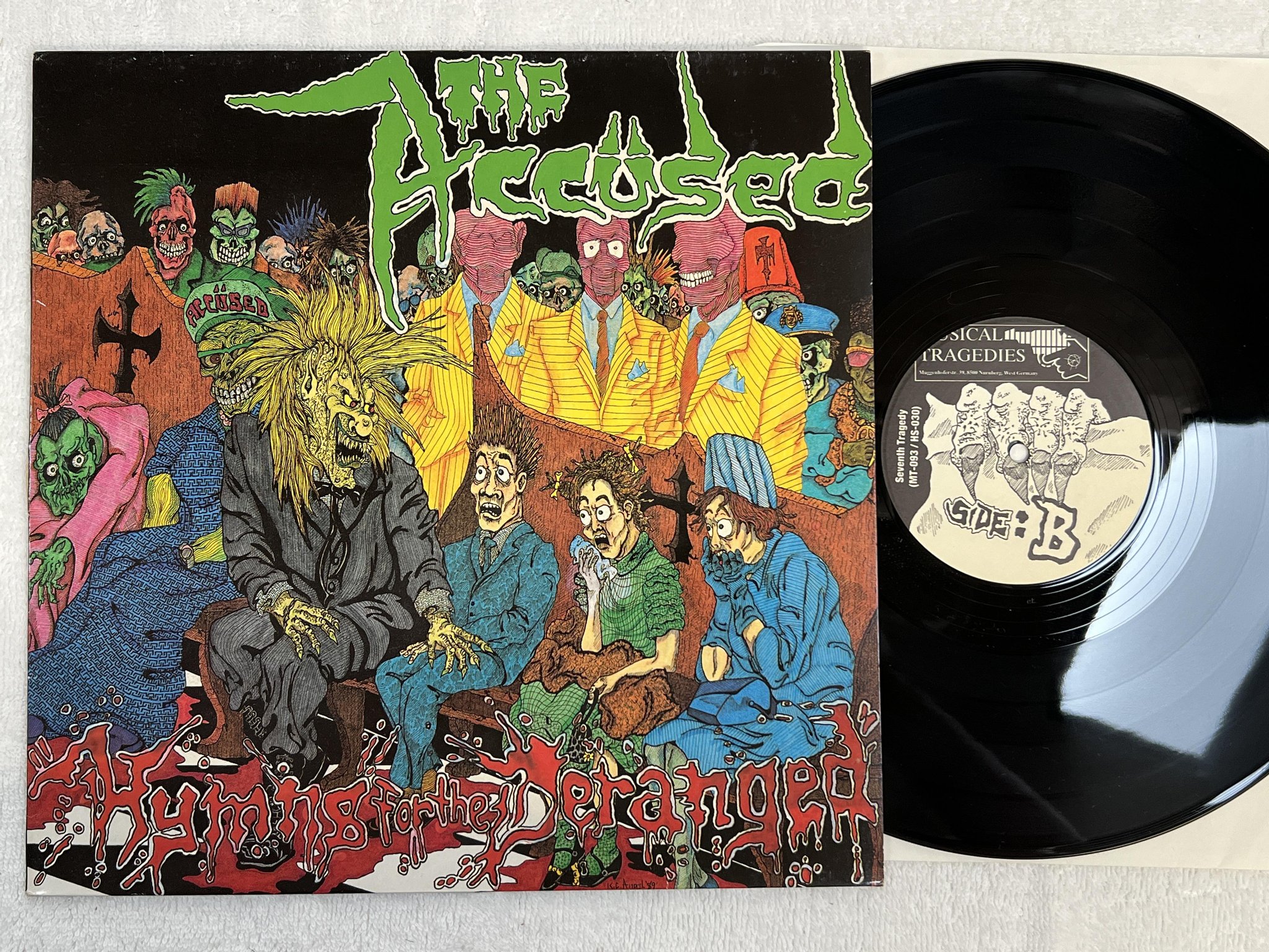 Omslagsbild för skivan THE ACCÜSED Hymns For The Deranged LP -89 Ger MUSICAL TRAGEDIES MT-093/HS-03