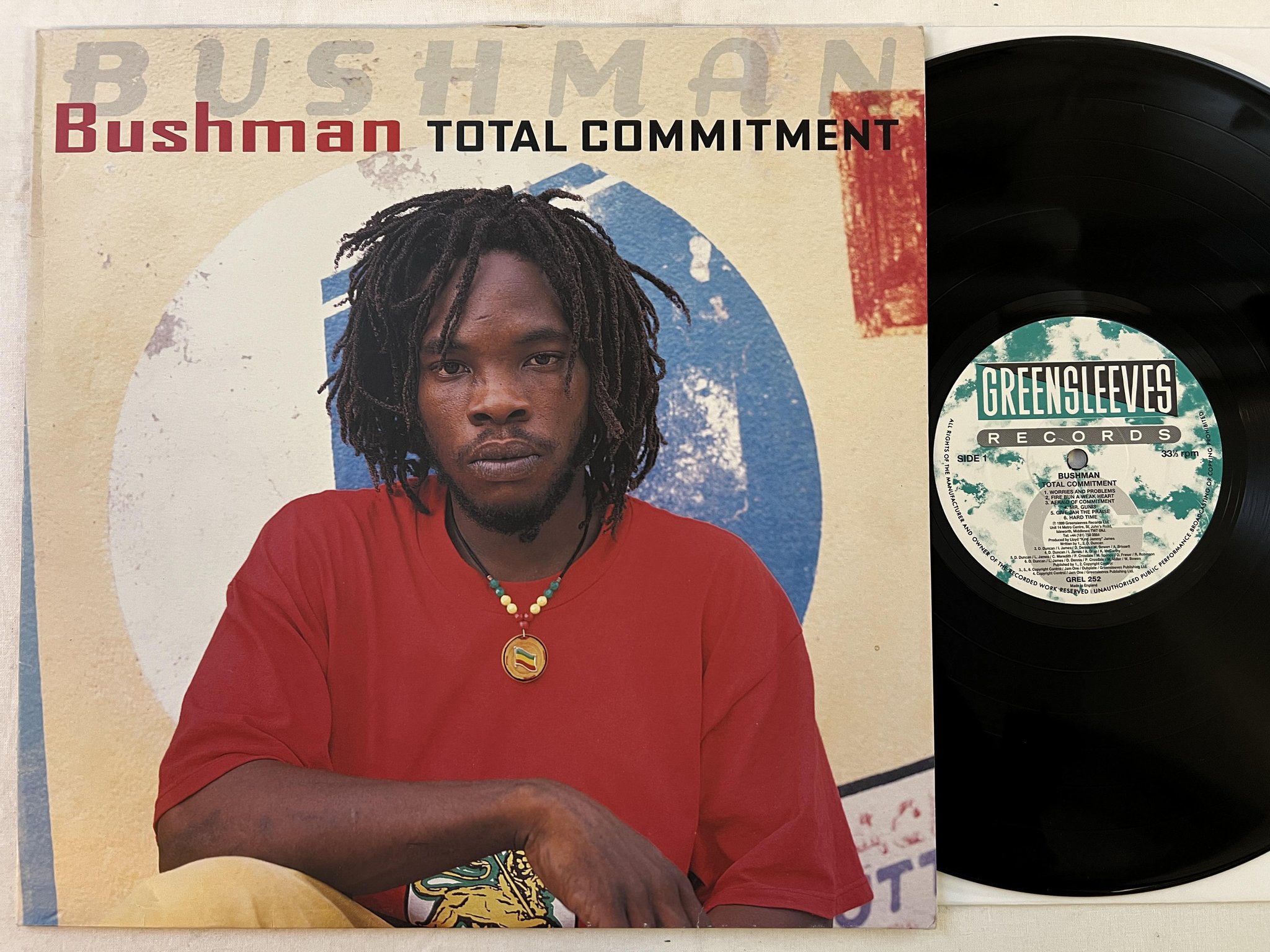 Omslagsbild för skivan BUSHMAN Total Commitment LP -99 UK GREENSLEEVES GREL 252