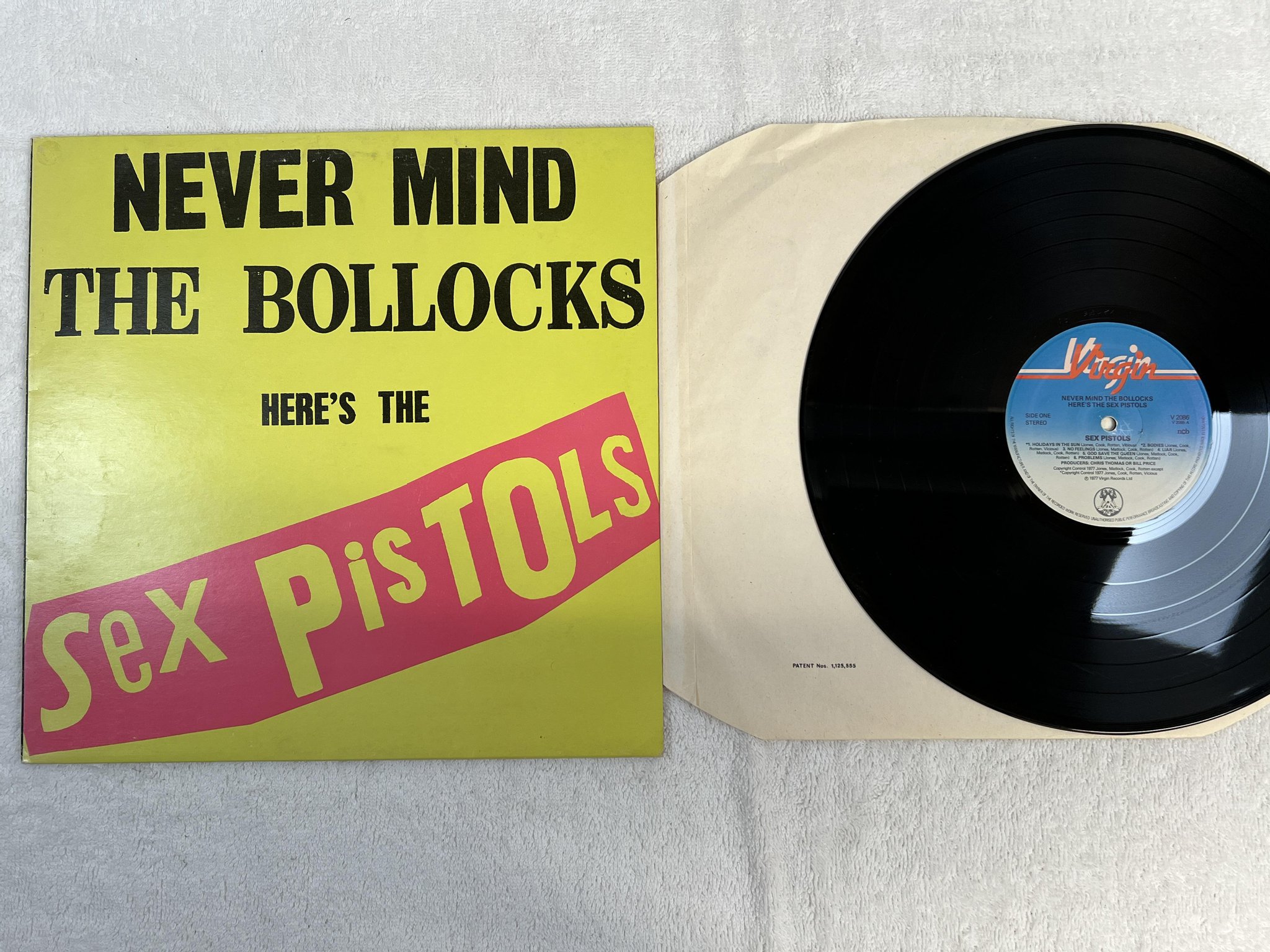 Omslagsbild för skivan SEX PISTOLS Never Mind The Bollocks Here's... LP -77 ncb VIRGIN V 2086