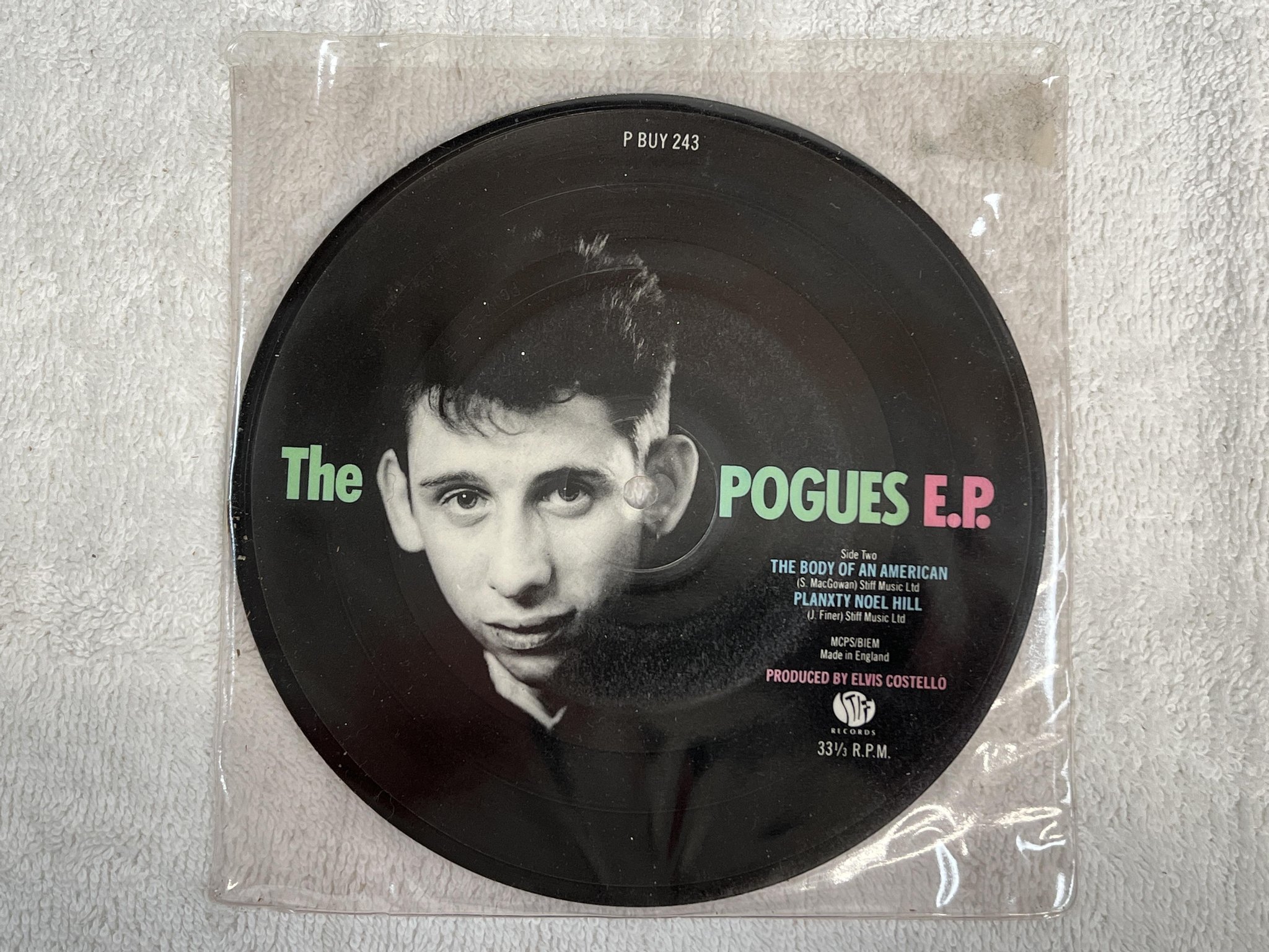 Omslagsbild för skivan THE POGUES Poguetry In Motion 7" picture disc -86 UK STIFF P BUY 243