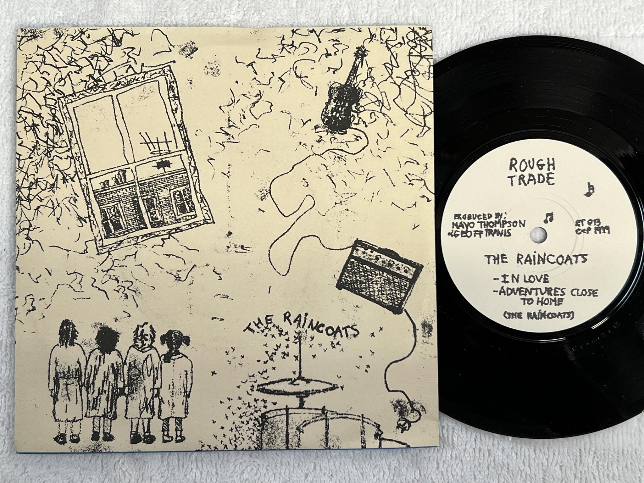 Omslagsbild för skivan THE RAINCOATS Fairytale In The Supermarket 7" -79 UK ROUGH TRADE RT 013