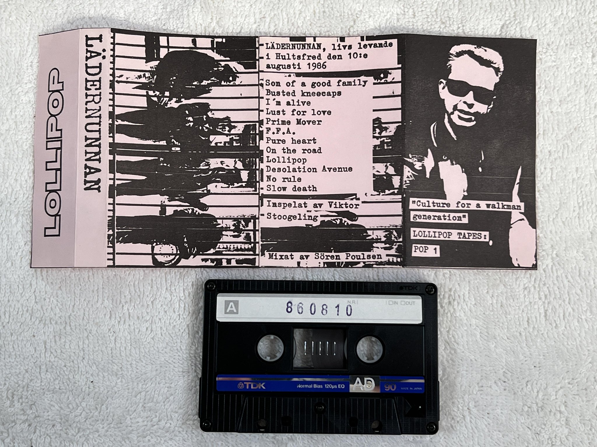 Omslagsbild för skivan LÄDERNUNNAN Live Hultsfred 1986 CASSETTE Swe LOLLIPOP TAPES POP-1