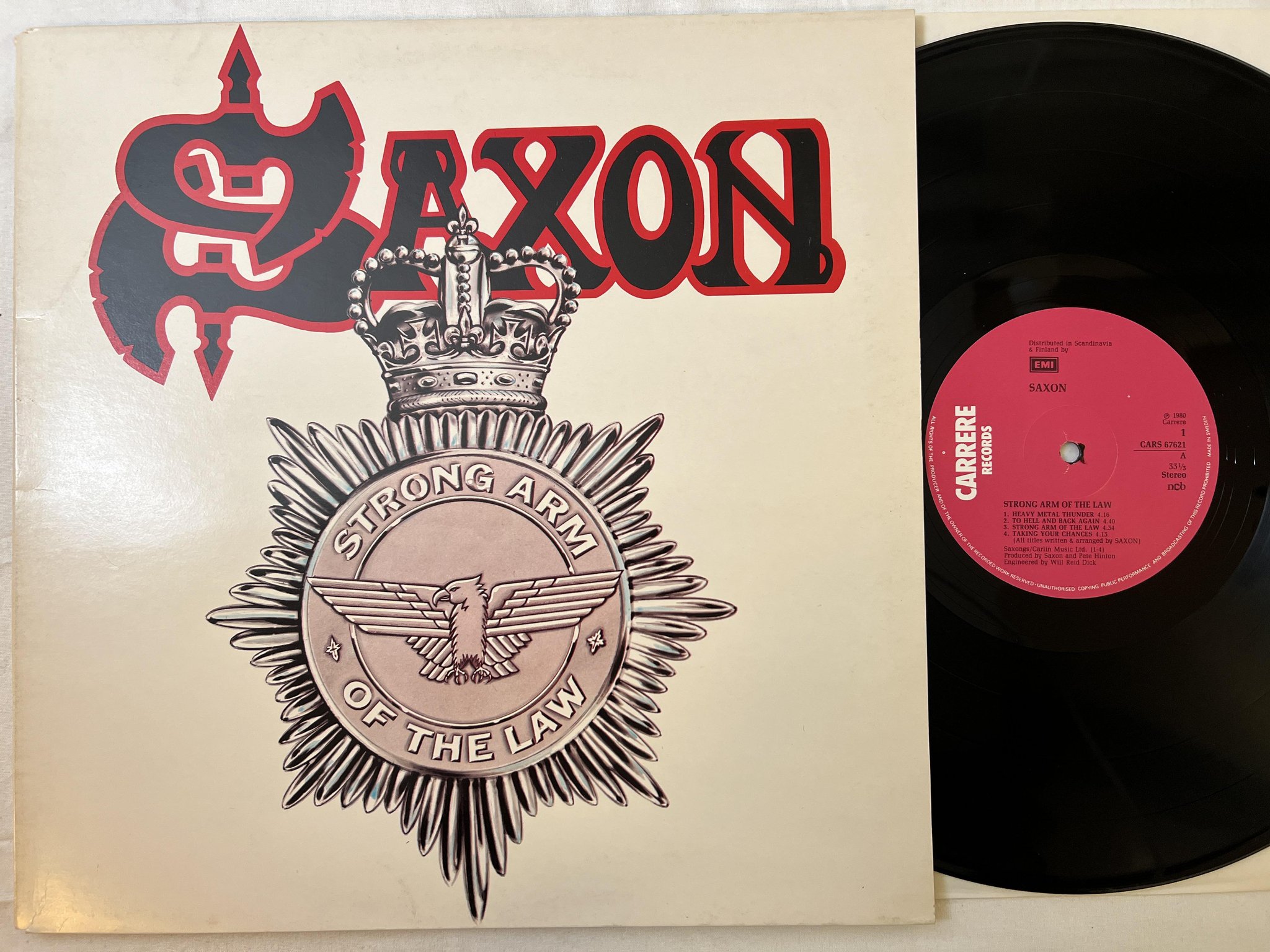 Omslagsbild för skivan SAXON strong arm of the law LP -80 ncb CARRERE CARS 67621