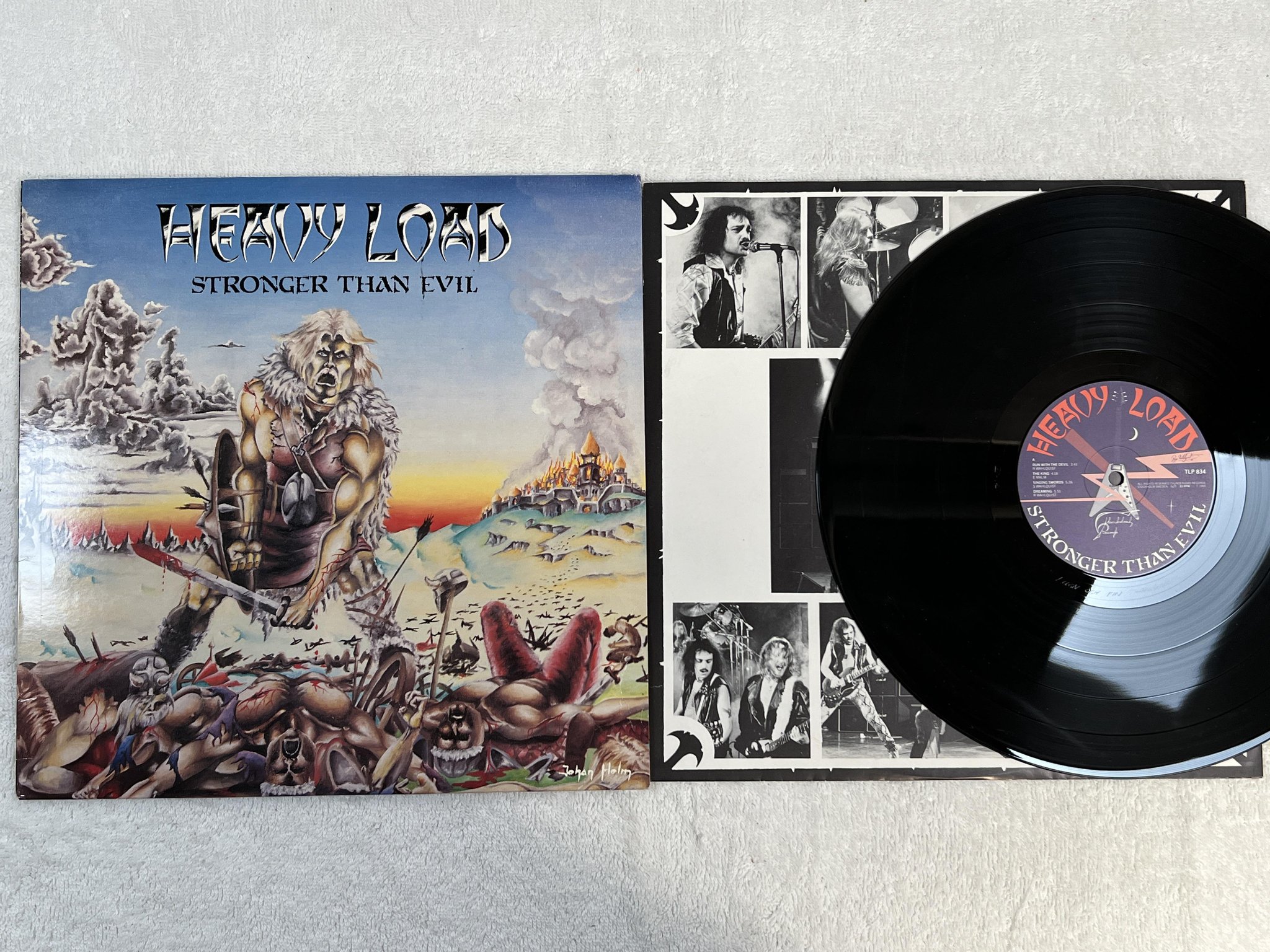 Omslagsbild för skivan HEAVY LOAD Stronger Than Evil LP -83 Swe THUNDERLOAD TLP 834 *** POSTER ***