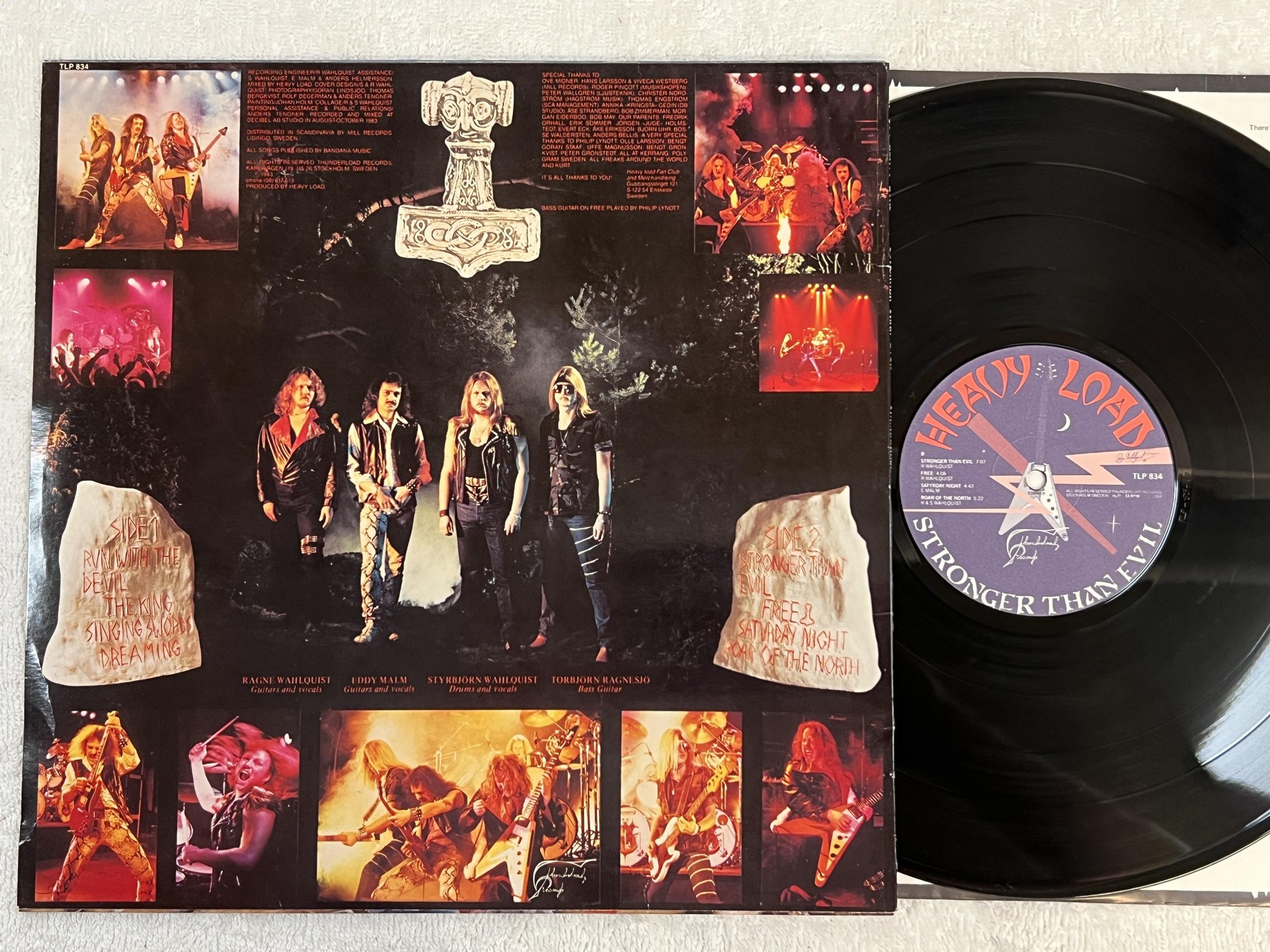 Omslagsbild för skivan HEAVY LOAD Stronger Than Evil LP -83 Swe THUNDERLOAD TLP 834 *** POSTER ***
