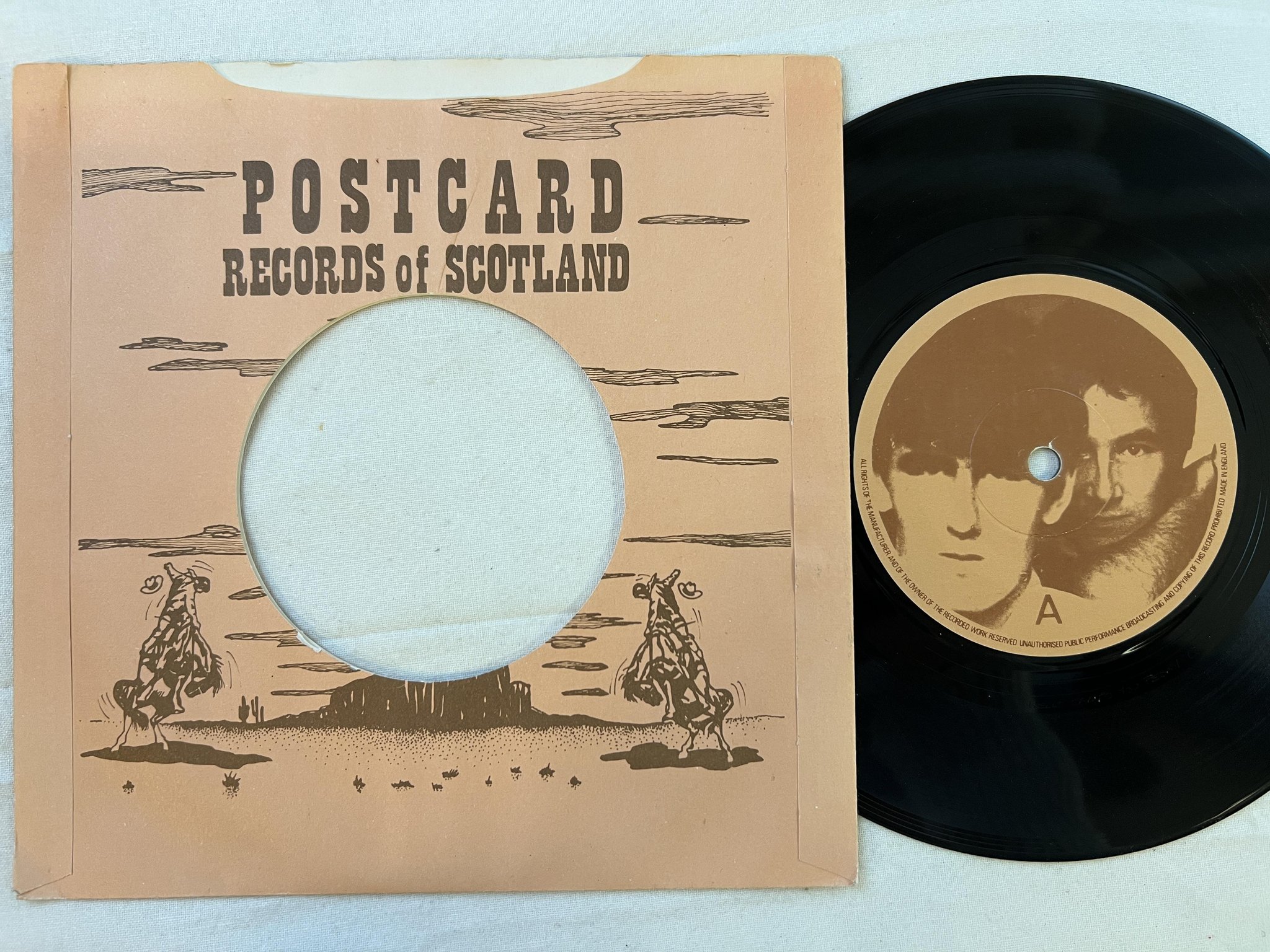 Omslagsbild för skivan THE GO-BETWEENS I need two heads 7" -80 Postcard 80-4 ** RARE NEW WAVE **