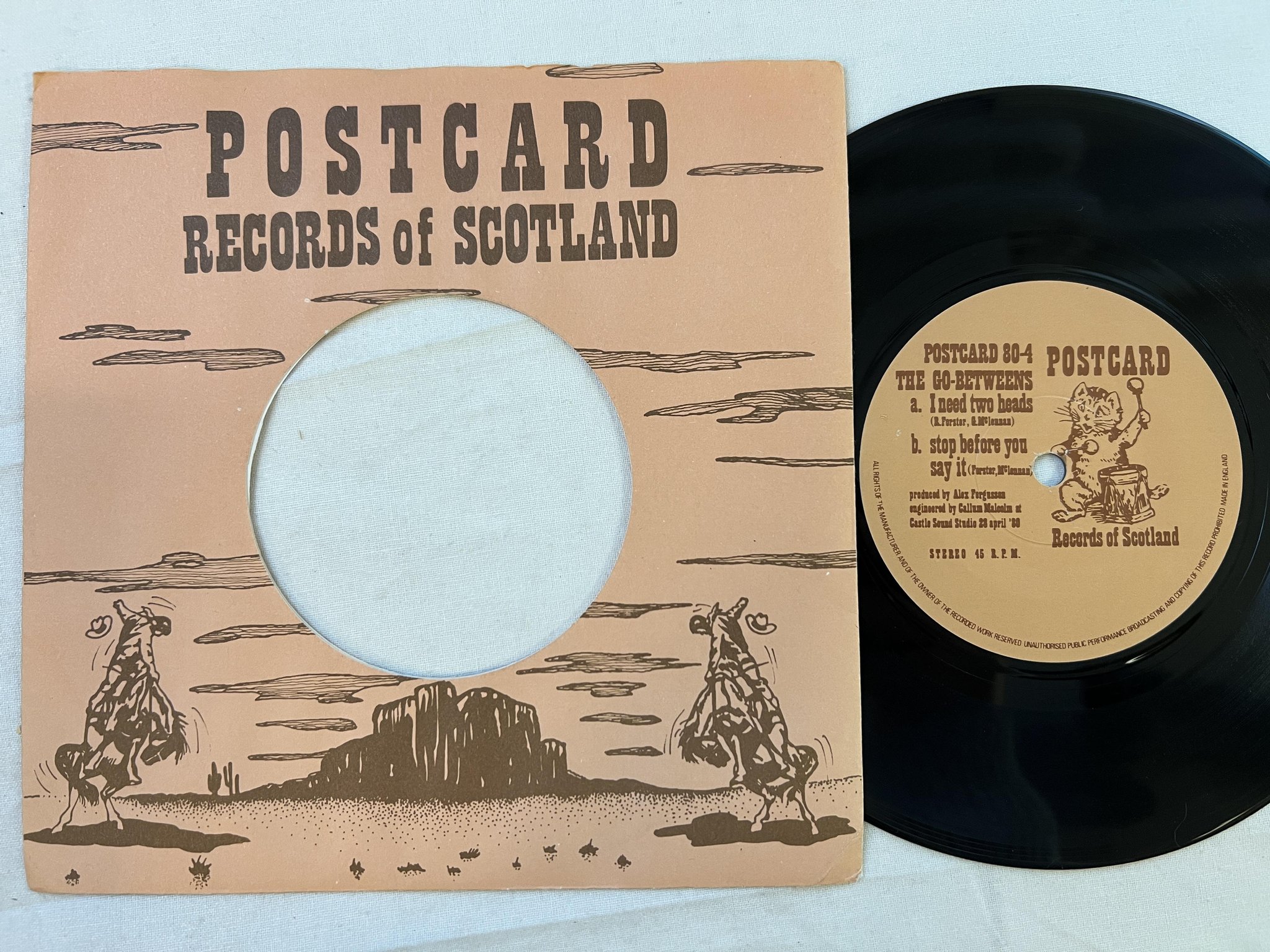 Omslagsbild för skivan THE GO-BETWEENS I need two heads 7" -80 Postcard 80-4 ** RARE NEW WAVE **