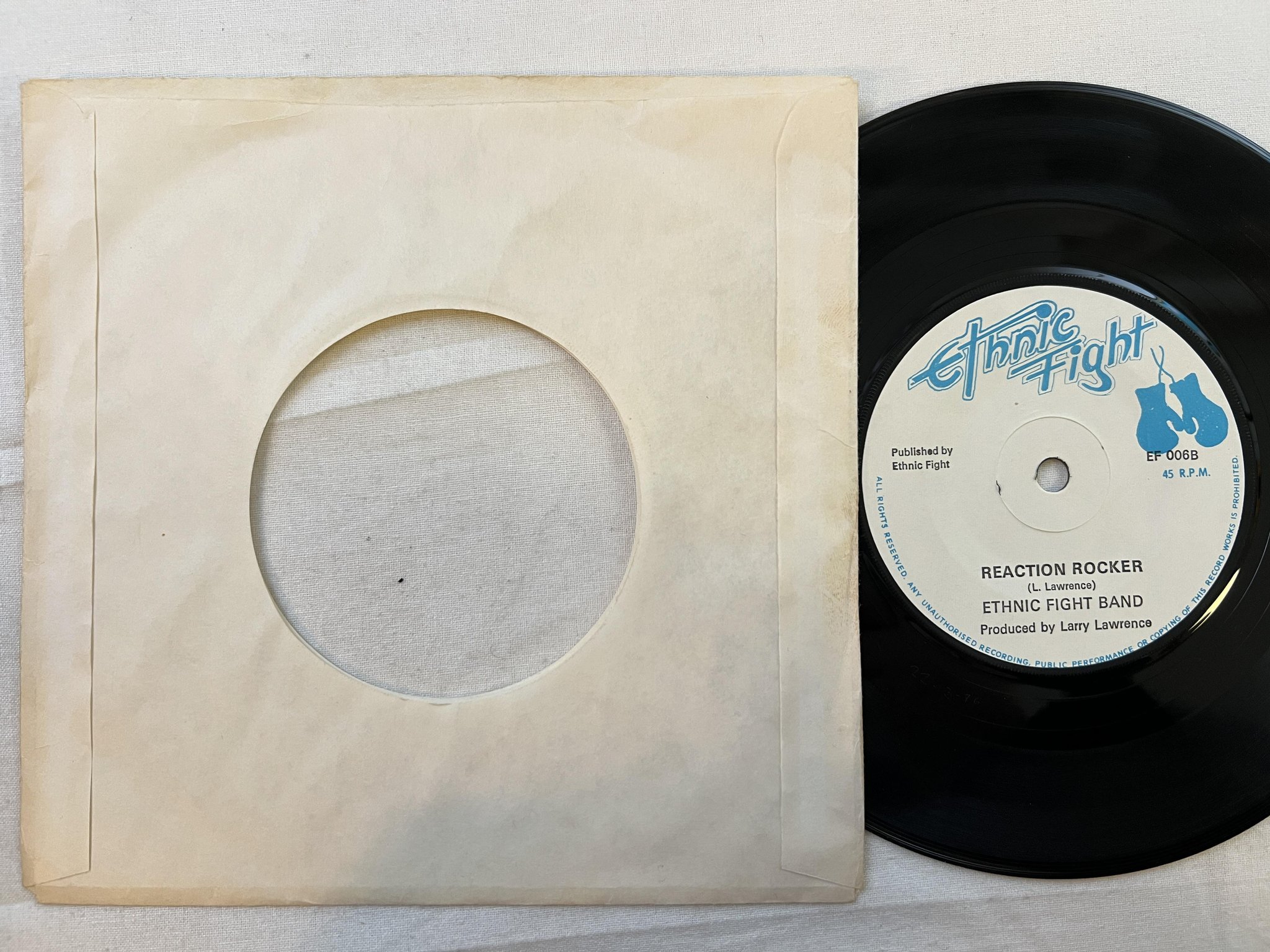 Omslagsbild för skivan JUNIOR HIBBERT reaction 7" -75 UK ETHNIC FIGHT EF 006