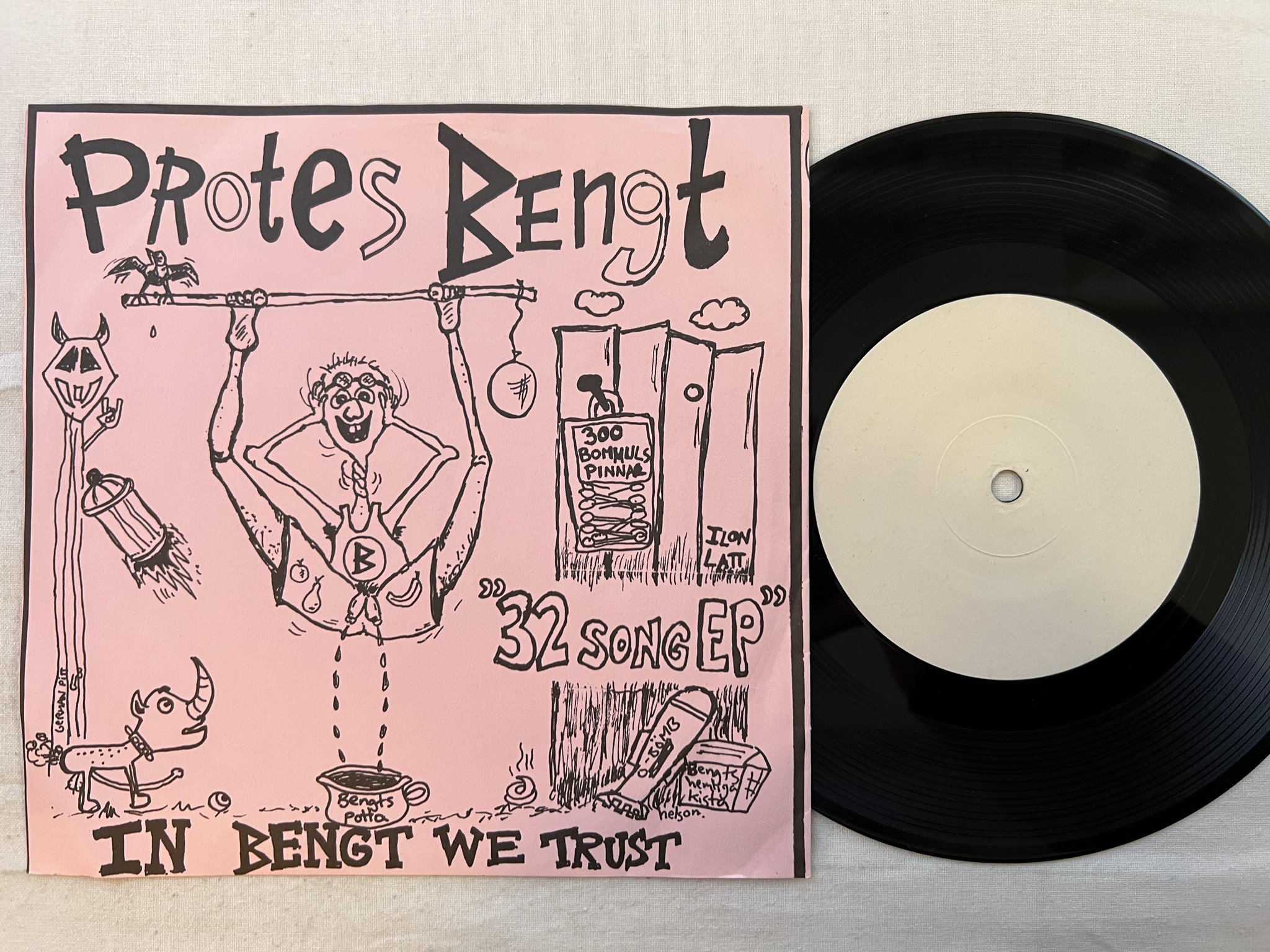 Omslagsbild för skivan PROTES BENGT In Bengt We Trust 7" -89 Swe UPROAR