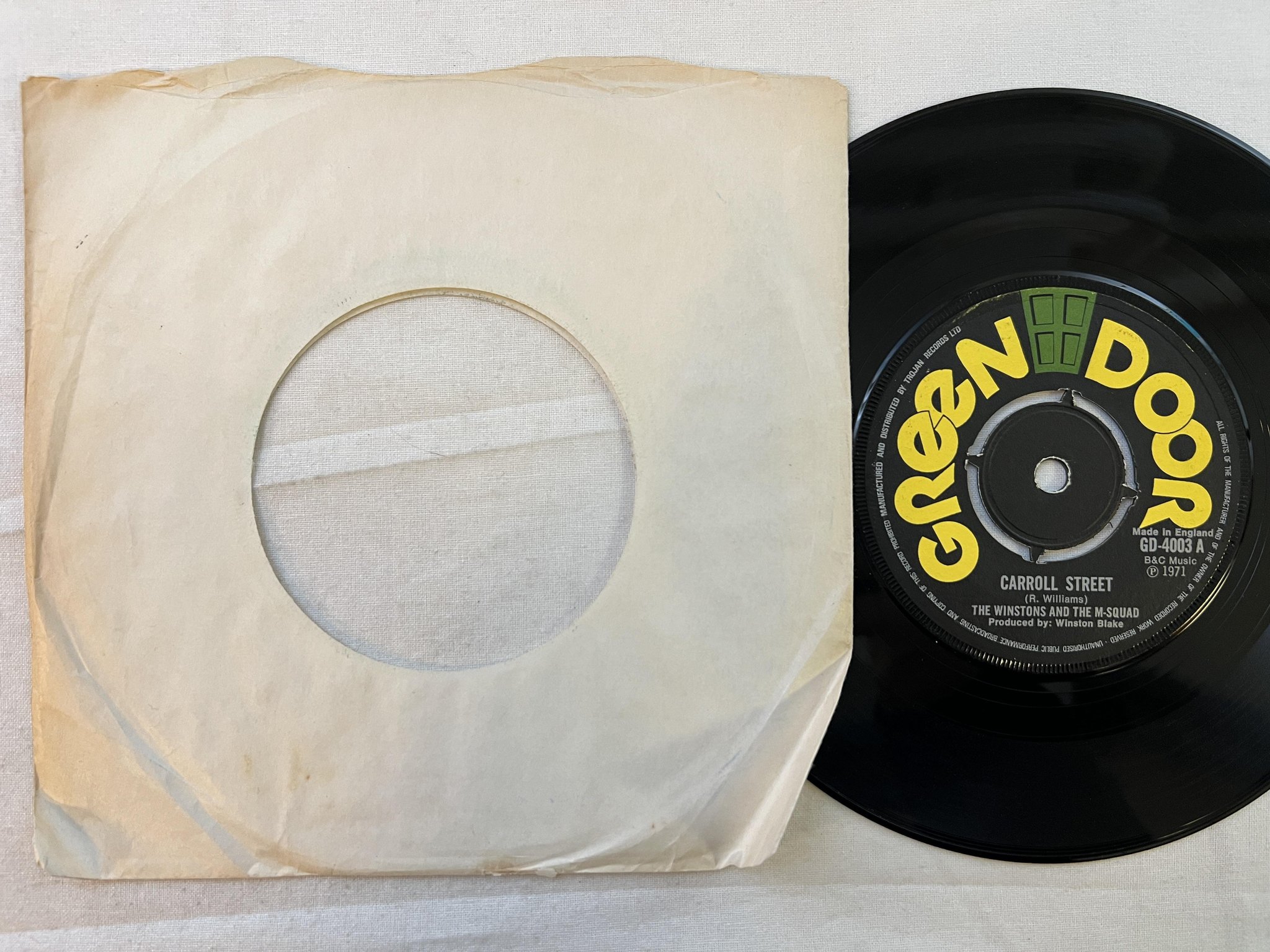 Omslagsbild för skivan THE WINSTONS & THE M SQUAD Carroll street 7" -71 UK GREEN DOOR GD-4003