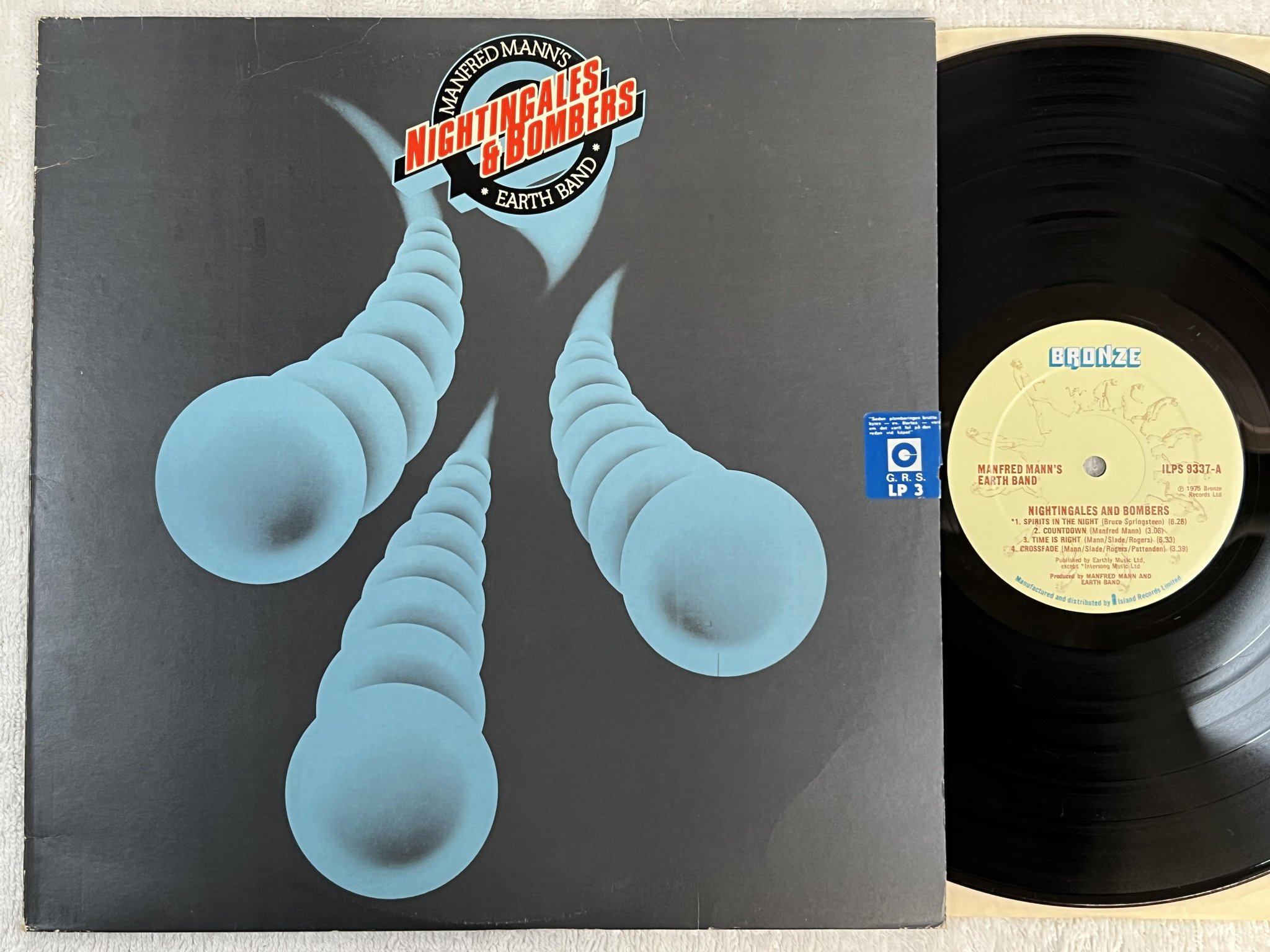 Omslagsbild för skivan MANFRED MAN'S EARTH BAND nightingales and bombers LP -75 UK BRONZE ILPS 9337