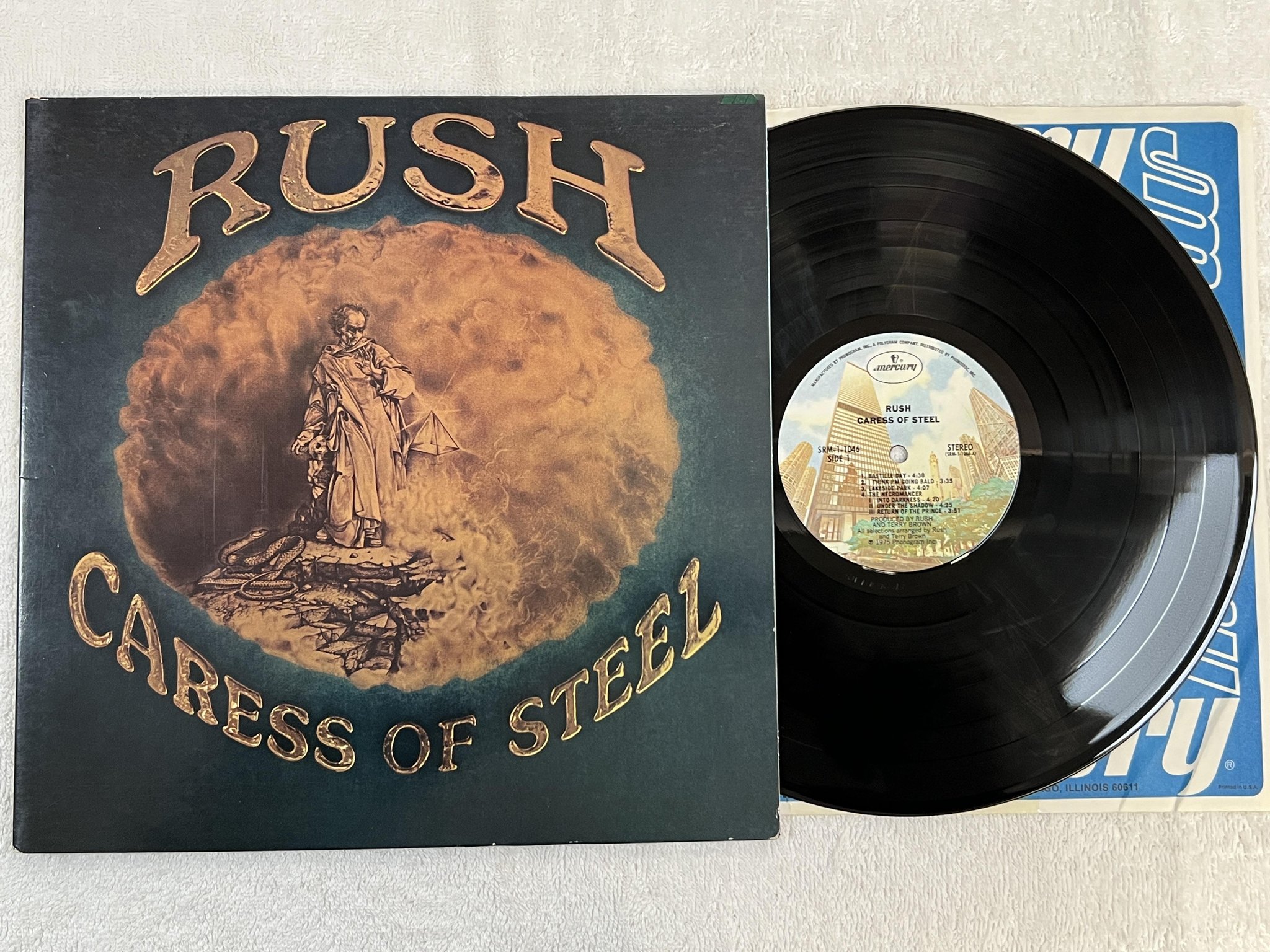 Omslagsbild för skivan RUSH caress of steel LP -75 US MERCURY SRM 1-1046
