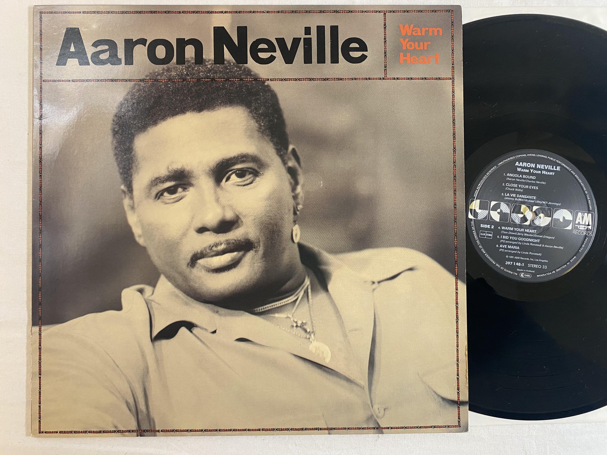 Omslagsbild för skivan AARON NEVILLE warm your heart LP -91 A&M 397148-1 *** audiophile ***