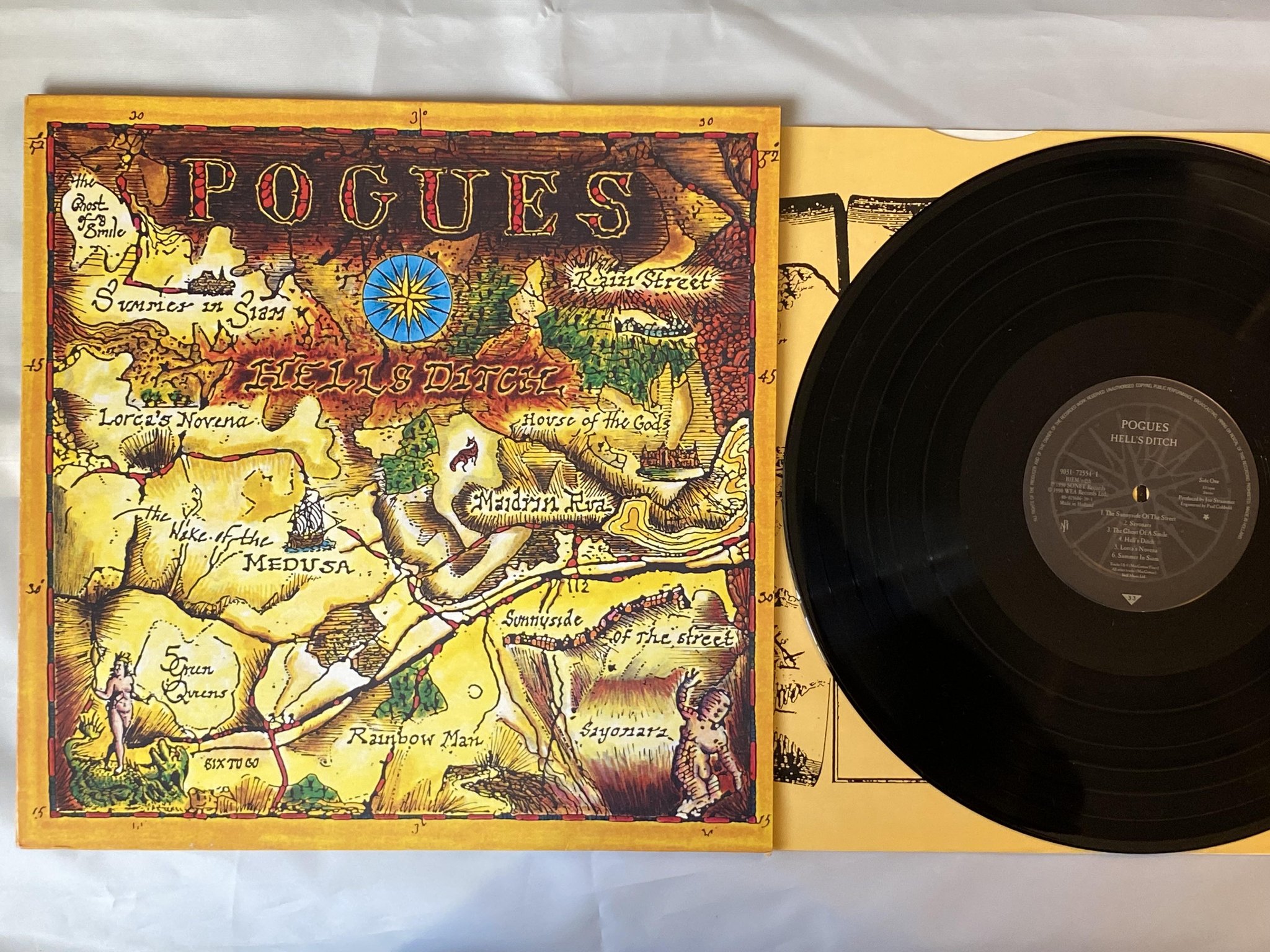 Omslagsbild för skivan THE POUGES Hell's Ditch LP -90 pogue mahone 9031-72554-1
