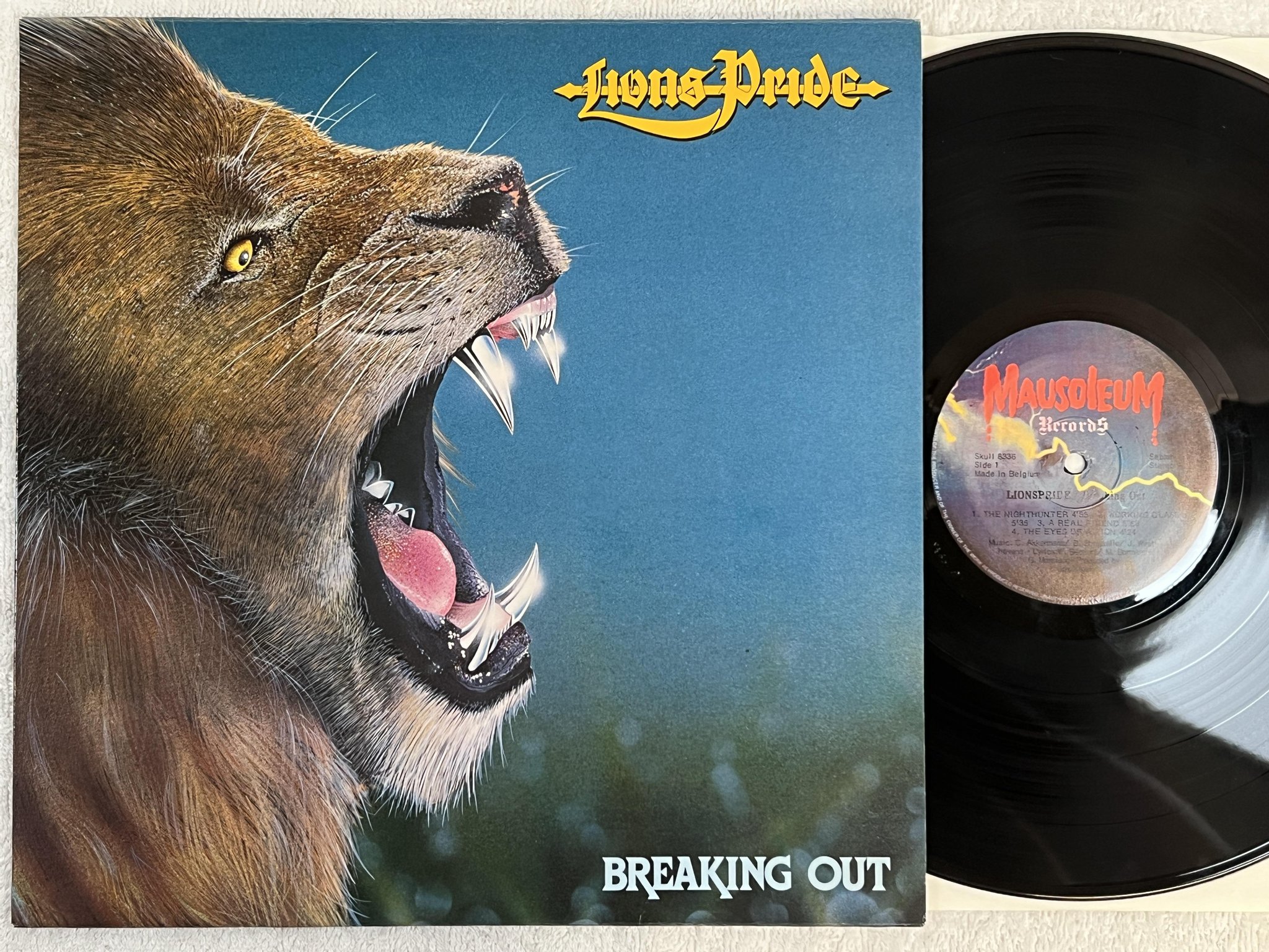 Omslagsbild för skivan LIONS PRIDE Breaking Out LP -84 Belgium MAUSOLEUM SKULL 8336