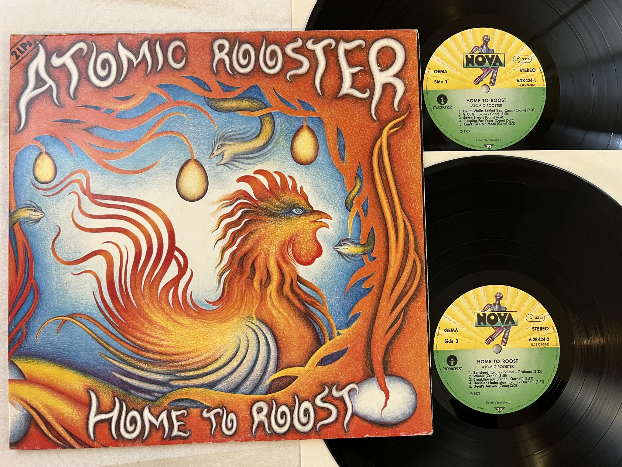 Omslagsbild för skivan ATOMIC ROOSTER home to roost 2xLP -77 Ger NOVA 628424-1