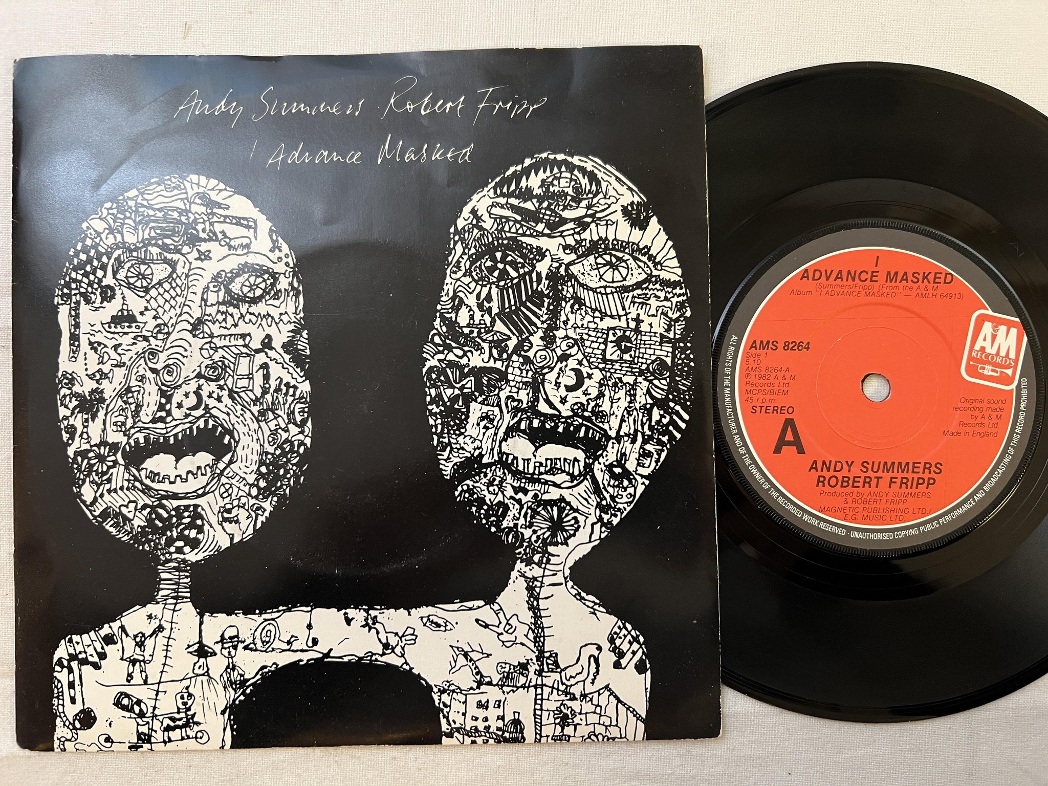Omslagsbild för skivan ANDY SUMMERS / ROBERT FRIPP advance masked 7" 82 UK A&M AMS 8264