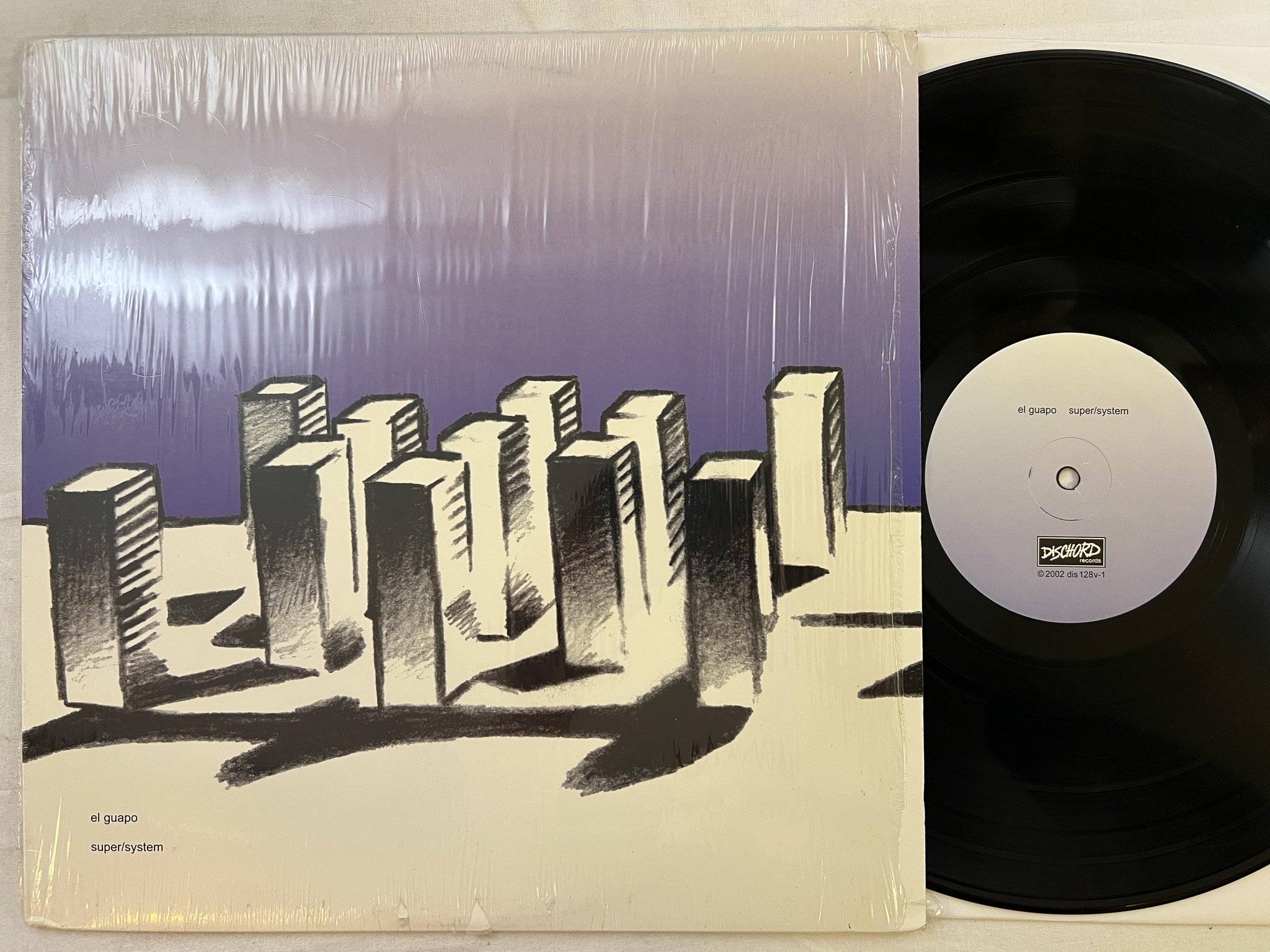 Omslagsbild för skivan EL GUAPO super/system LP 2002 US DISCHORD dis128v *** art rock ***