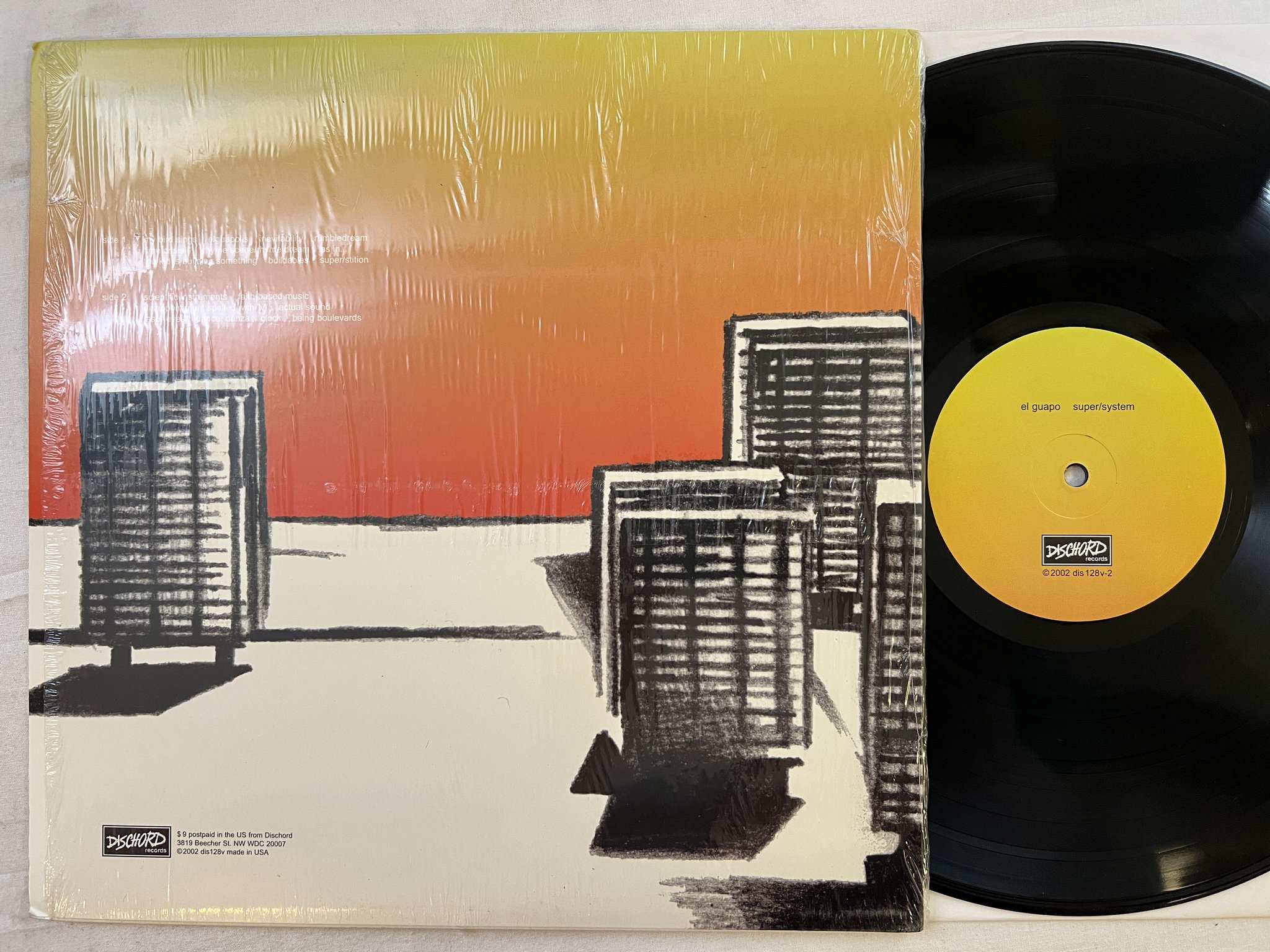 Omslagsbild för skivan EL GUAPO super/system LP 2002 US DISCHORD dis128v *** art rock ***