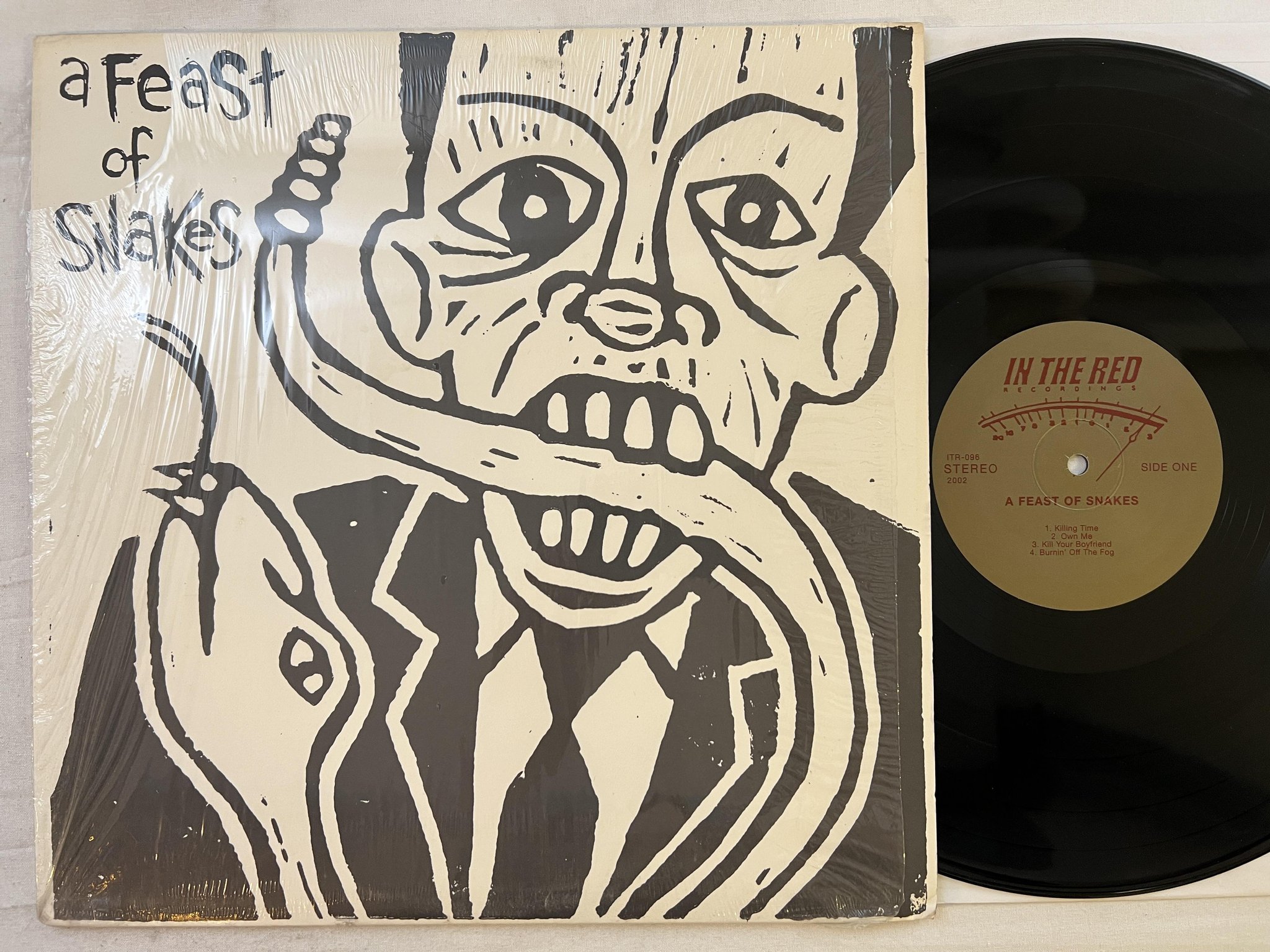 Omslagsbild för skivan A FEAST OF SNAKES s/t LP 2002 US IN THE RED ITR096