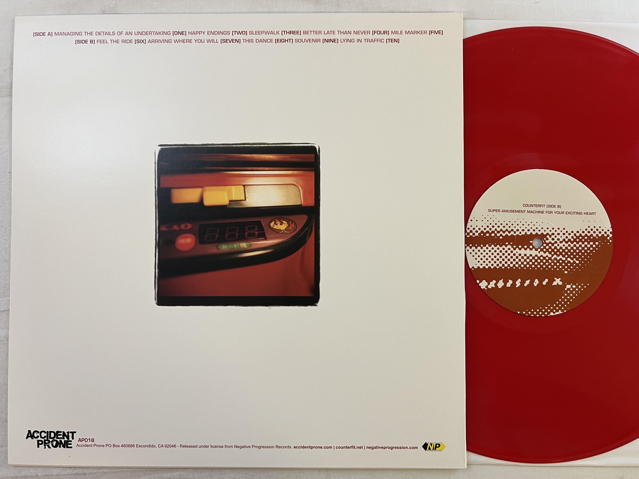Omslagsbild för skivan COUNTERFIT Super Amusement Machine For Your Exciting Heart LP US ** RED VINYL **