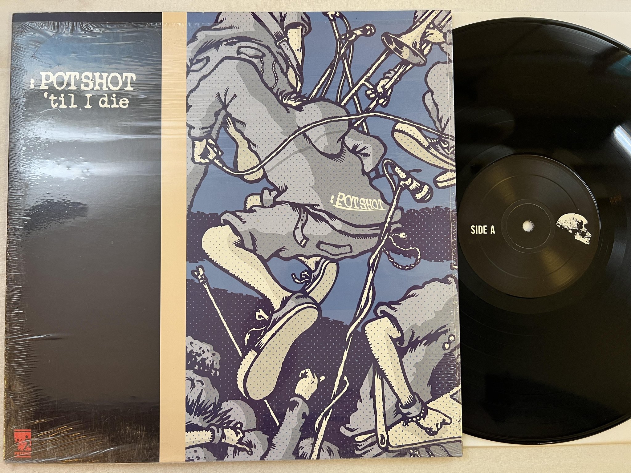 Omslagsbild för skivan POTSHOT 'Til I Die LP 2000 US asian man AM-062 *** SKA / PUNK ***