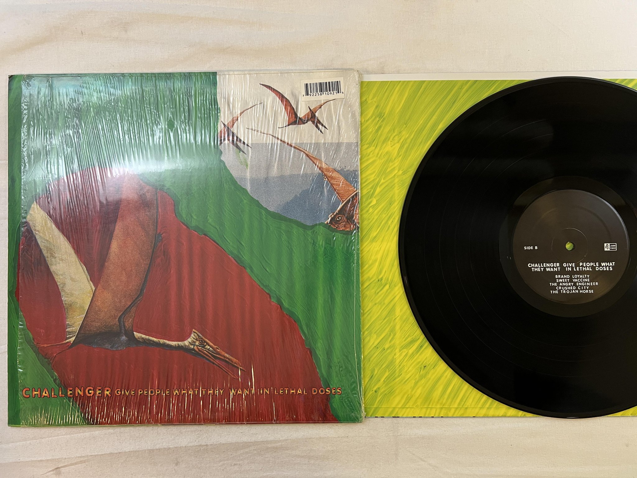 Omslagsbild för skivan CHALLENGER Give People What They Want In Lethal Doses LP 2004 US jade tree