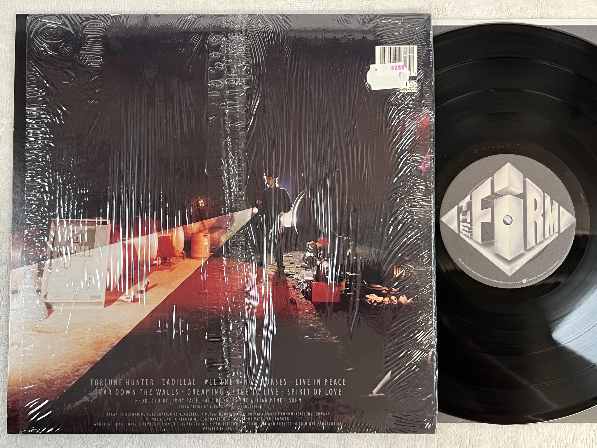 Omslagsbild för skivan THE FIRM mean business LP -86 US ATLANTIC 7 81628-1E