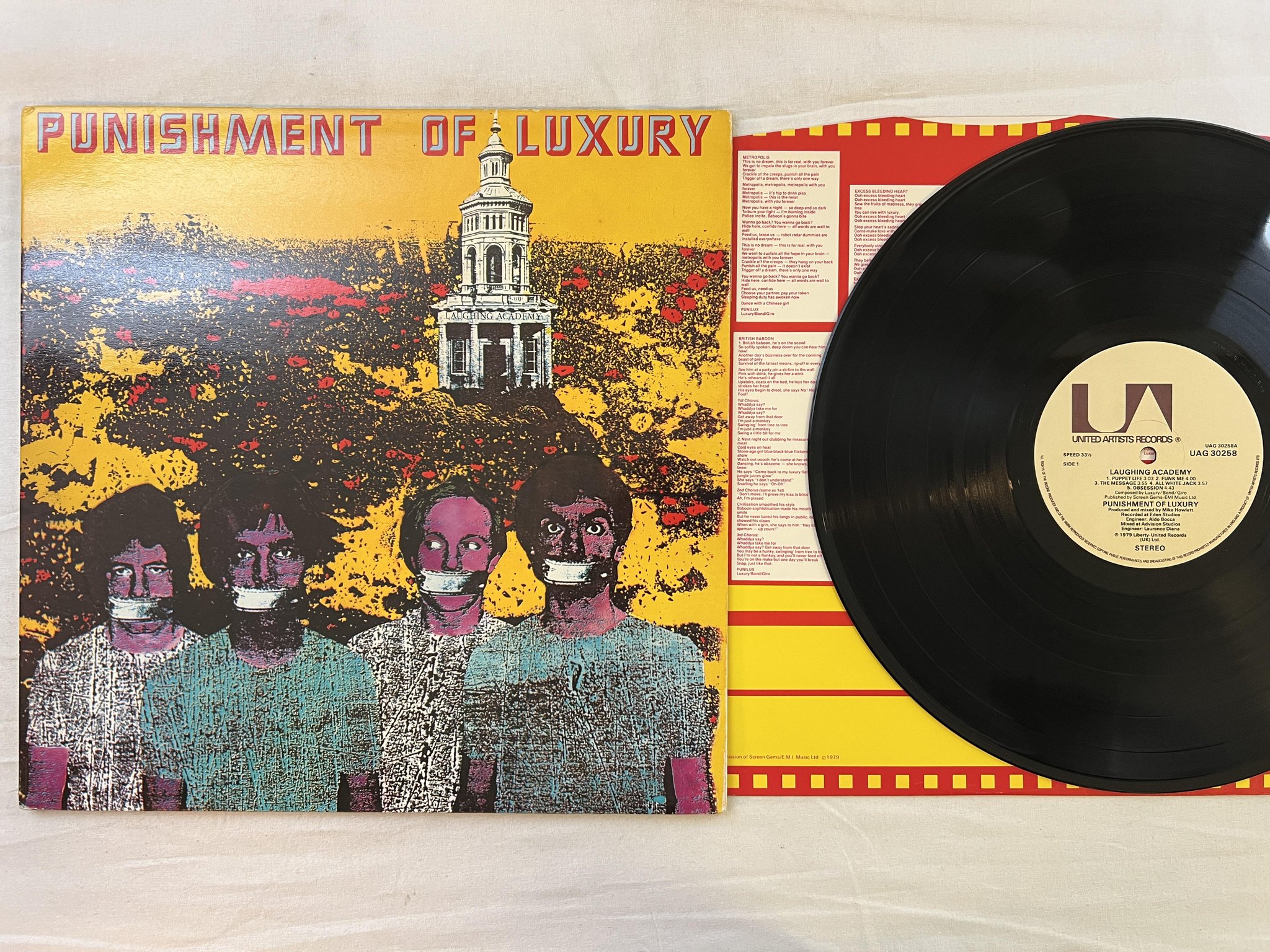 Omslagsbild för skivan PUNISHMENT OF LUXURY Laughing Academy LP -79 UK UNITED UAG 30258