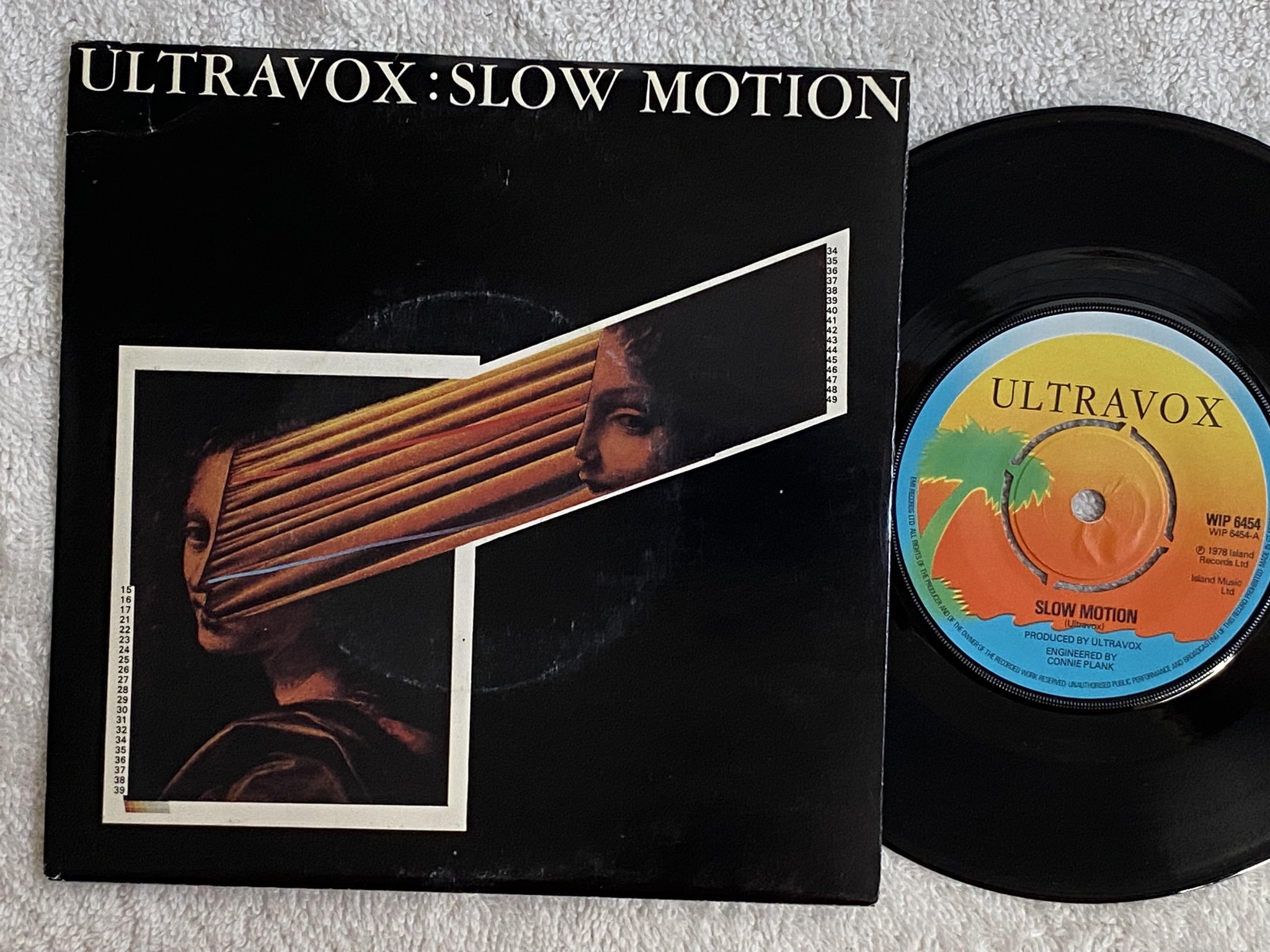 Omslagsbild för skivan ULTRAVOX slow motion 7" -78 UK ISLAND WIP 6454
