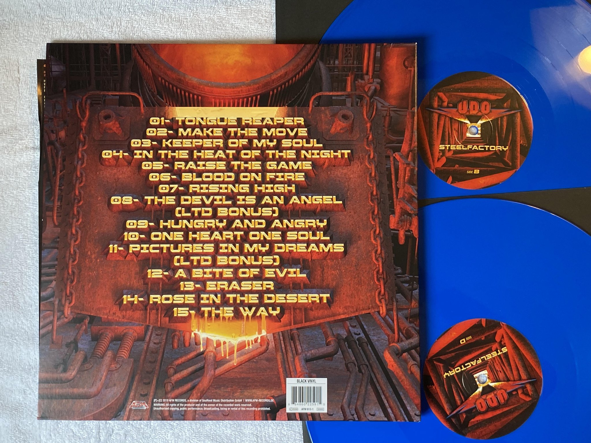 Omslagsbild för skivan U.D.O. Steelfactory 2xLP 2018 Swe AFM 613-1 *** BLUE VINYL ***