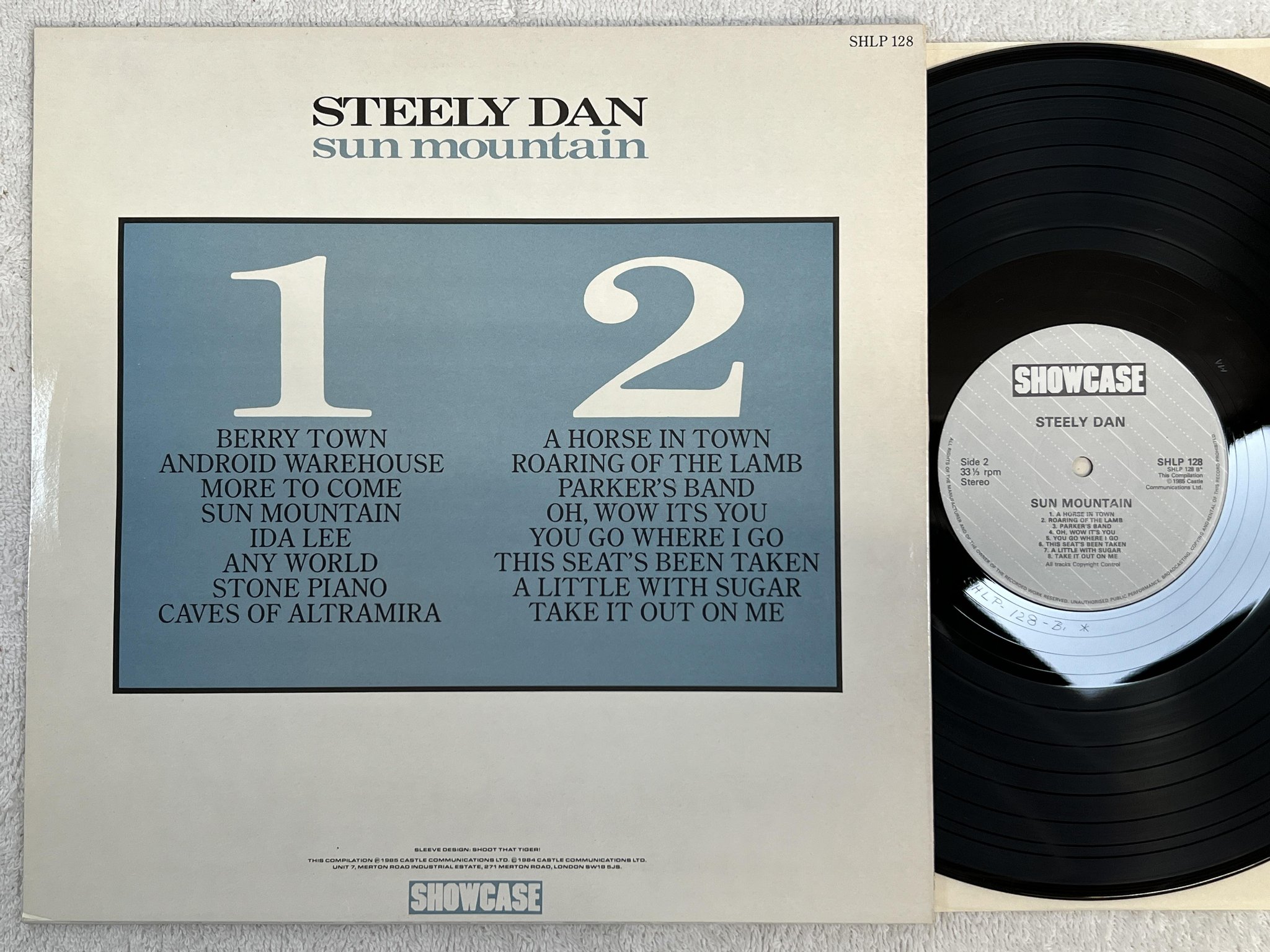 Omslagsbild för skivan STEELY DAN Sun Mountain LP -85 SHOWCASE SHLP 128