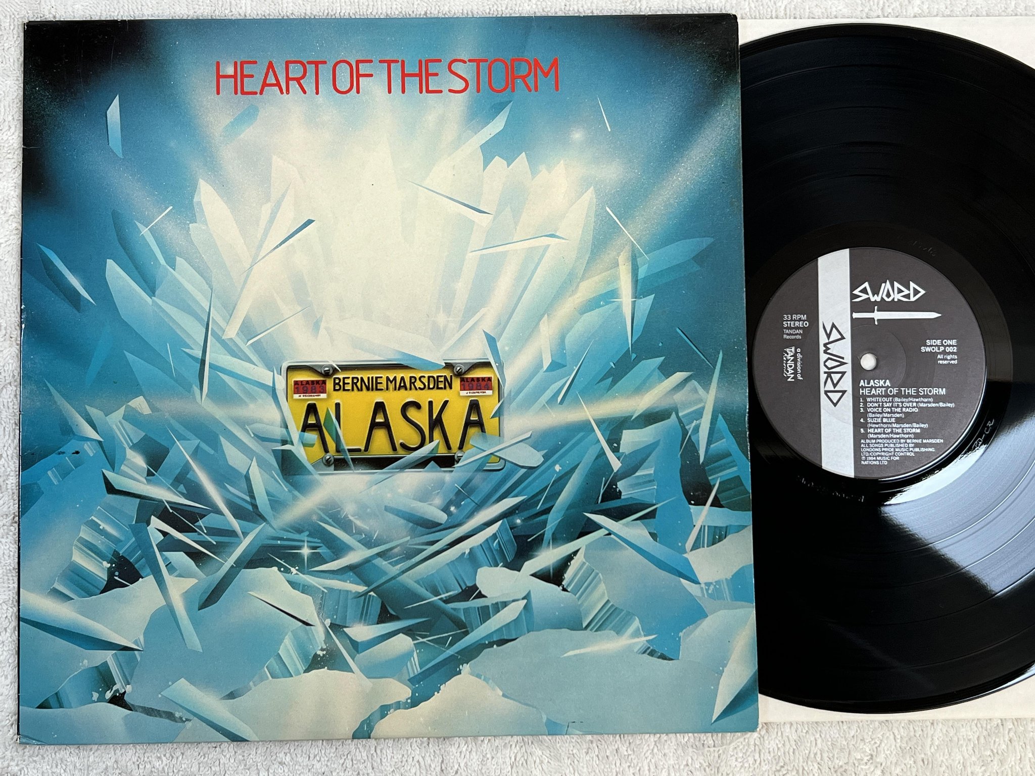 Omslagsbild för skivan ALASKA heart of the storm LP -84 ncb SWORD SWOLP 002