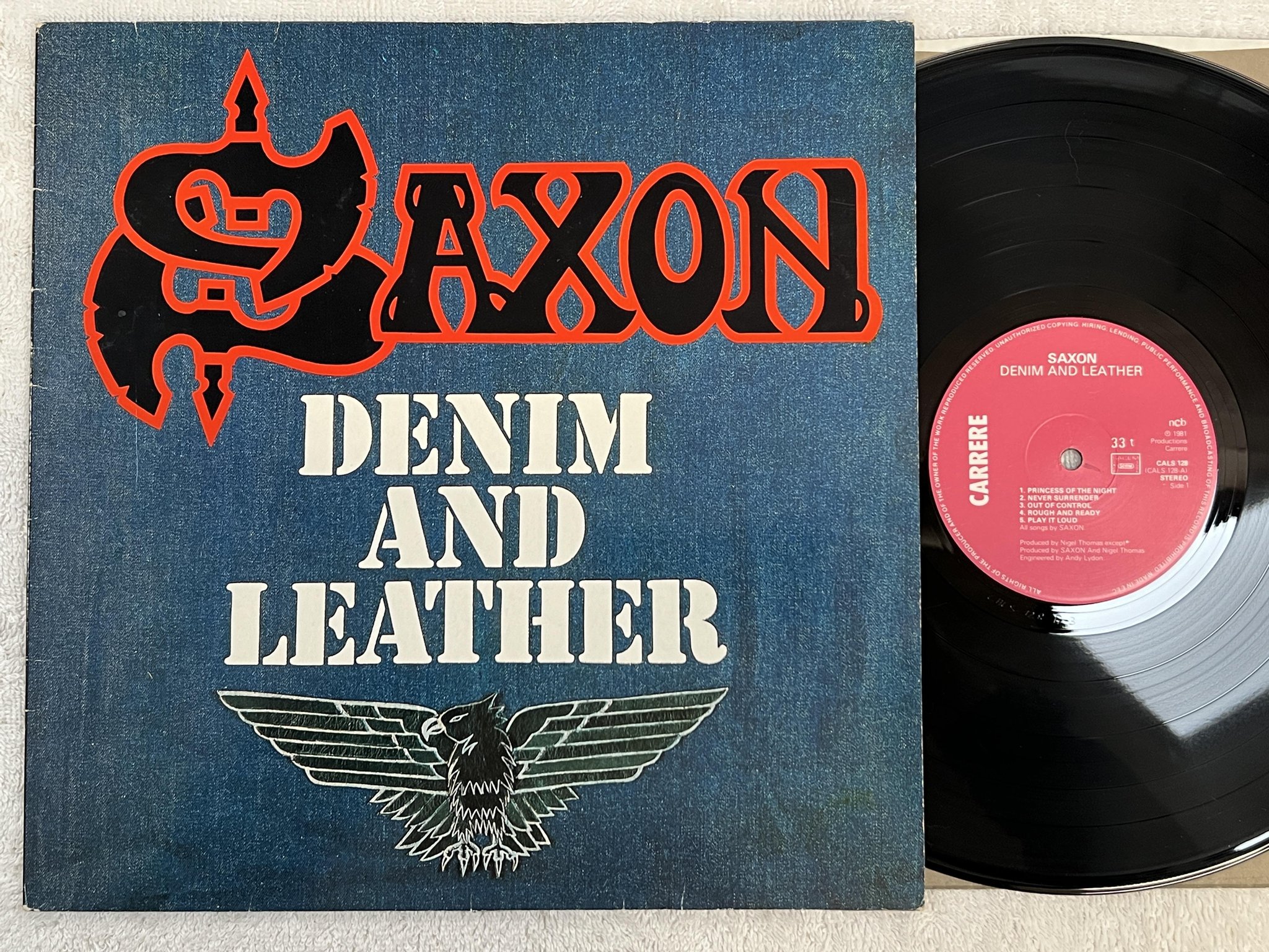 Omslagsbild för skivan SAXON denim and leather LP -81 ncb CARRERE CALS 128