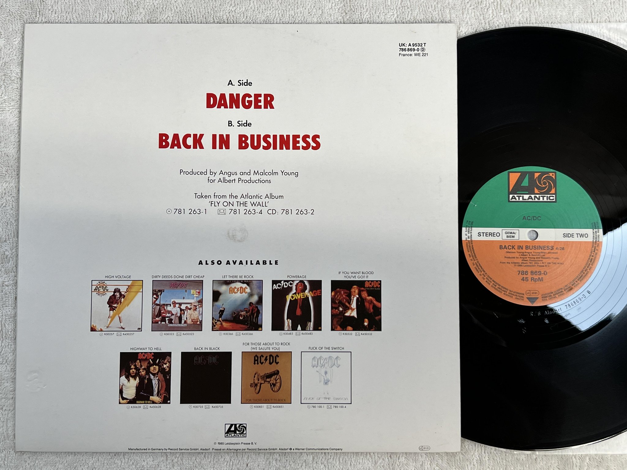 Omslagsbild för skivan AC/DC back in business 12" -85 Ger ATLANTIC 786 869-0