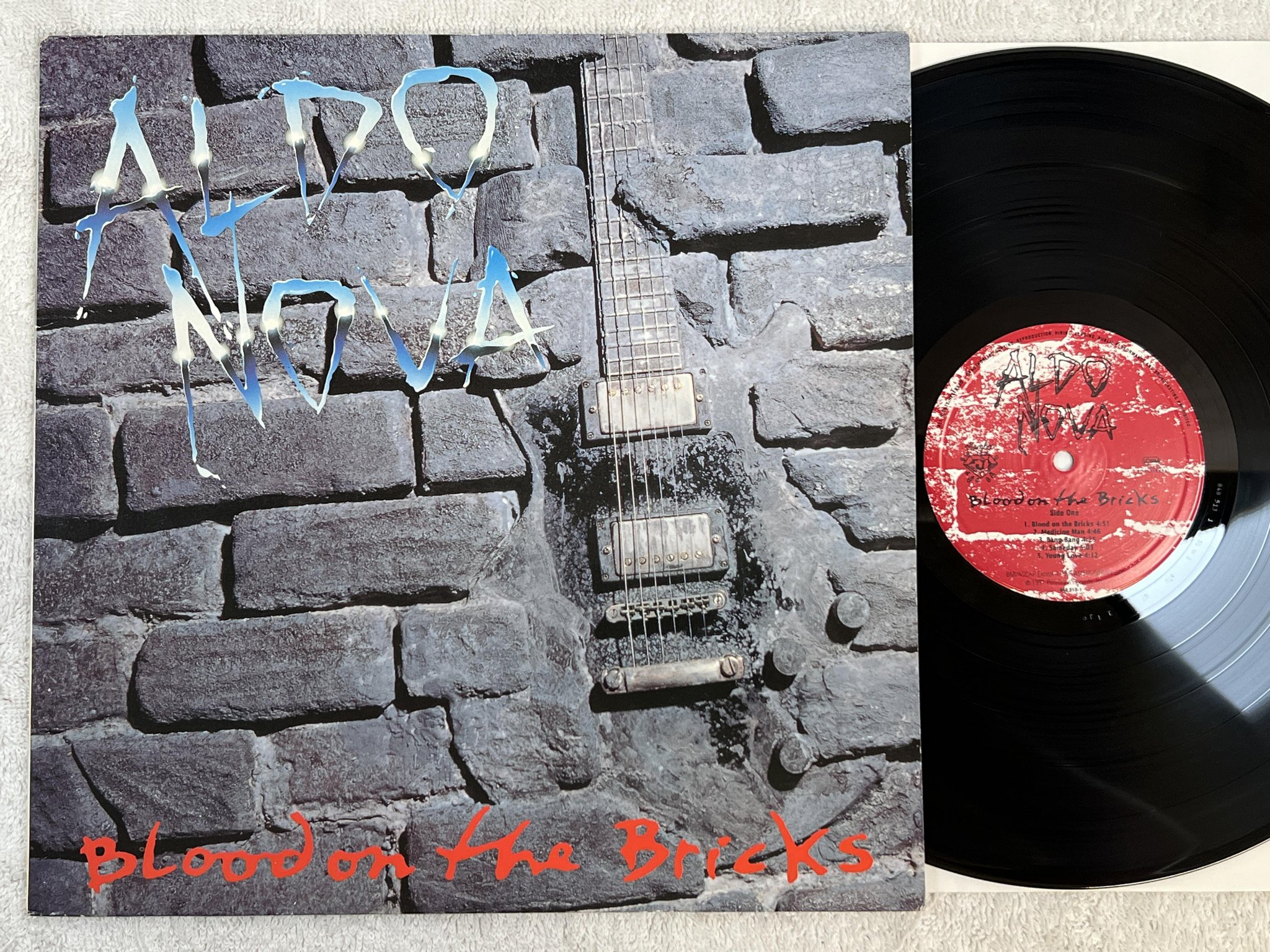 Omslagsbild för skivan ALDO NOVA Blood On The Bricks LP -91 jambco 848 513-1