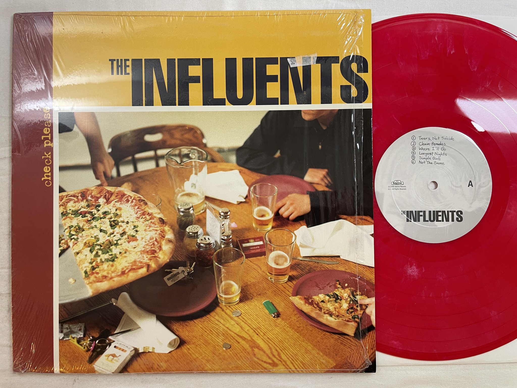 Omslagsbild för skivan THE INFLUENTS Check Please LP 2000 US ADELINE 011-1 *** PUNK ***