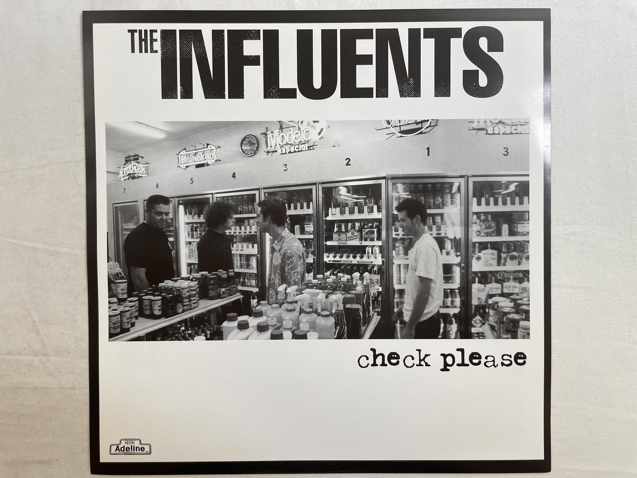 Omslagsbild för skivan THE INFLUENTS Check Please LP 2000 US ADELINE 011-1 *** PUNK ***