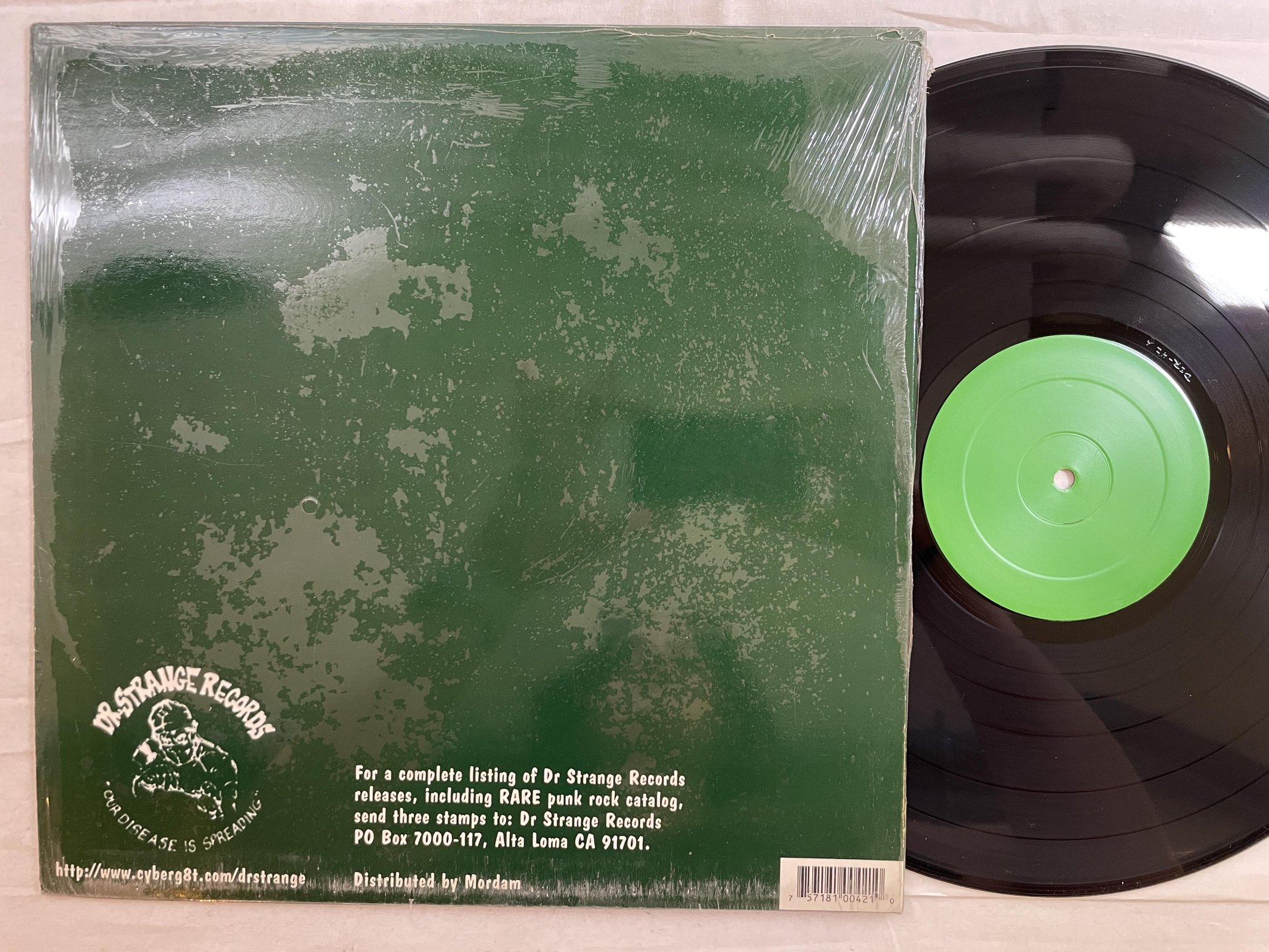 Omslagsbild för skivan SKANKIN PICKLE The Green Album LP -96 US DR STRANGE DSR-42 *** punk / ska ***