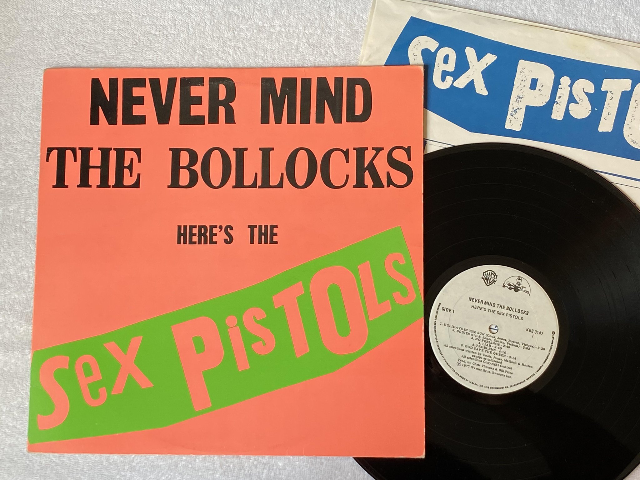 Omslagsbild för skivan SEX PISTOLS never mind the bollocks LP re Can WARNER KBS 3147