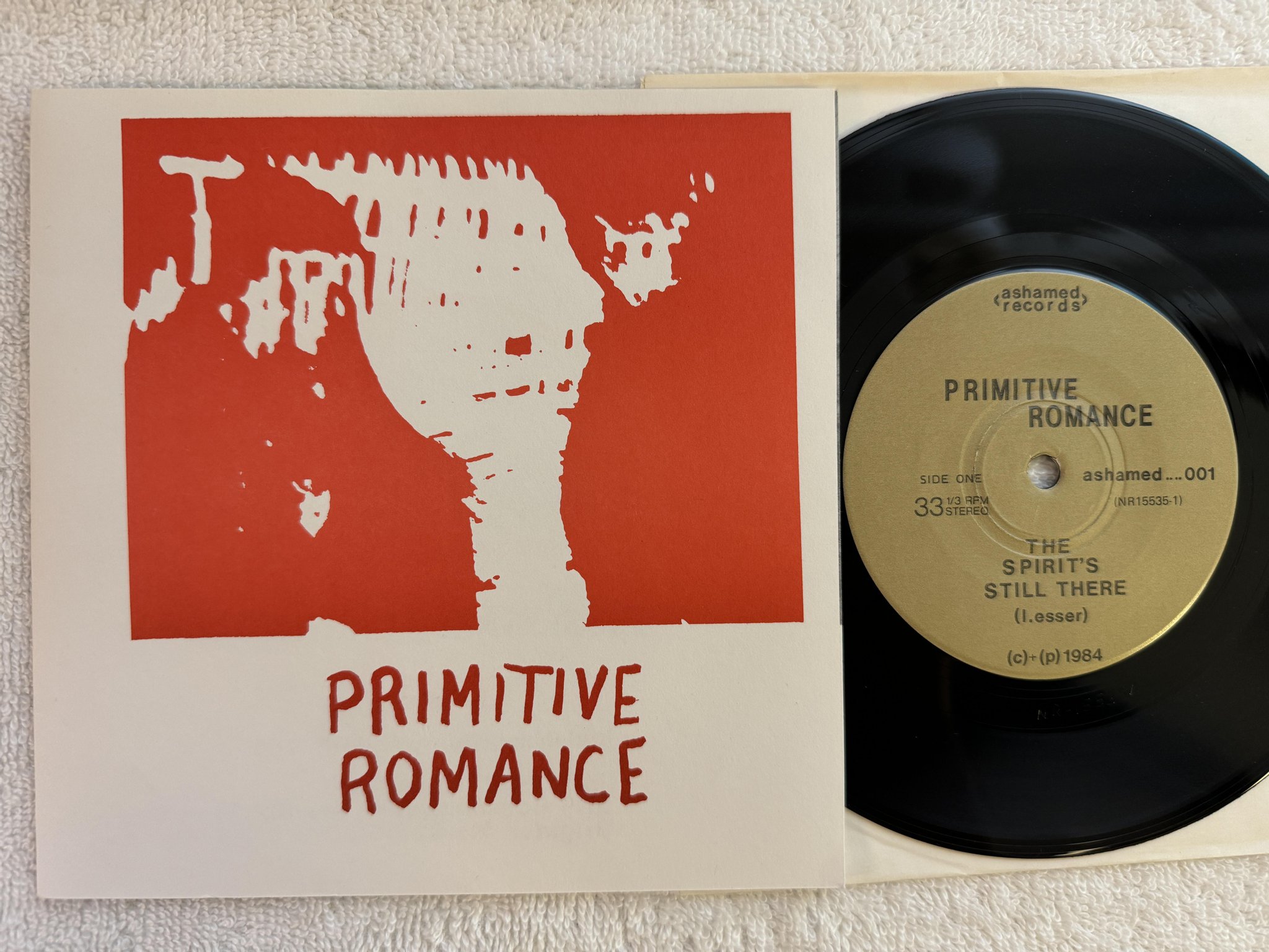 Omslagsbild för skivan PRIMITIVE ROMANCE The Spirit's Still There 7" -84 US ashamed 001