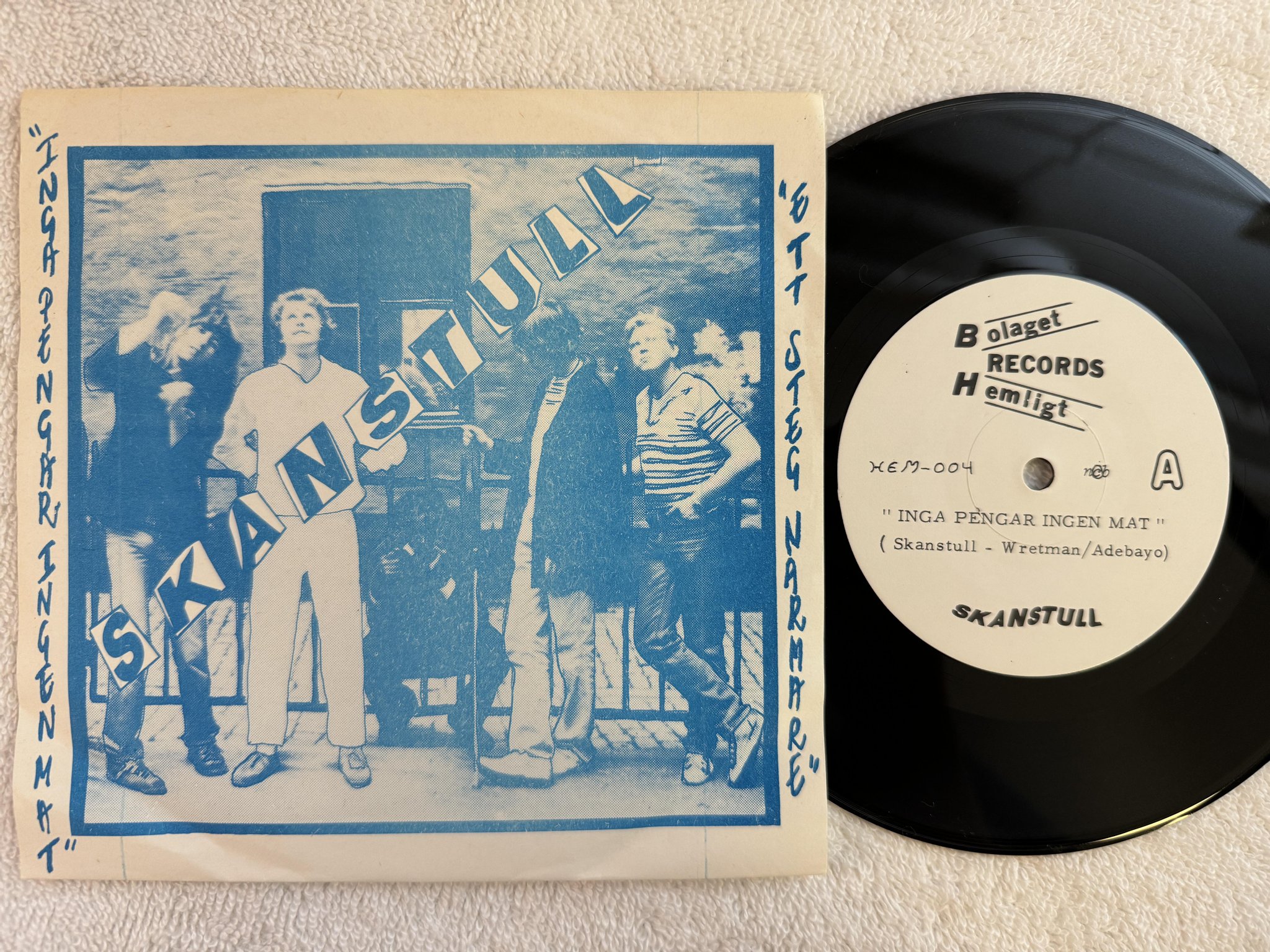 Omslagsbild för skivan SKANSTULL Inga Pengar Ingen Mat 7" -80 HELIGA BOLAGET HEM-004Z
