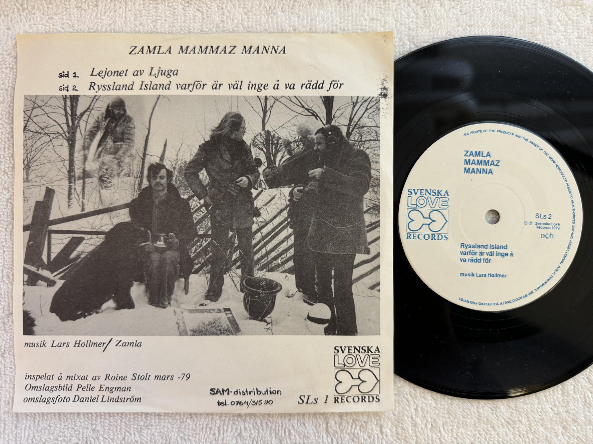 Omslagsbild för skivan ZAMLA MAMMAZ MANNA lejonet av Ljuga 7" -79 SVENSKA LOVE SLs-1