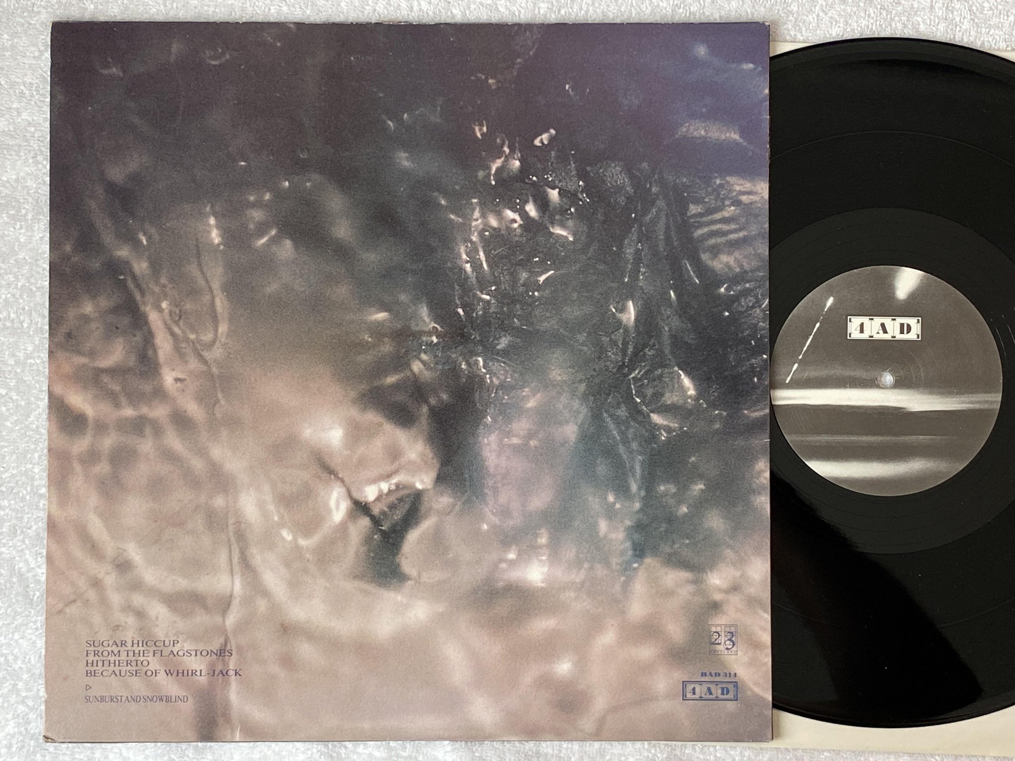 Omslagsbild för skivan COCTEAU TWINS Sunburst And Snowblind 12"EP -83 4AD BAD 314