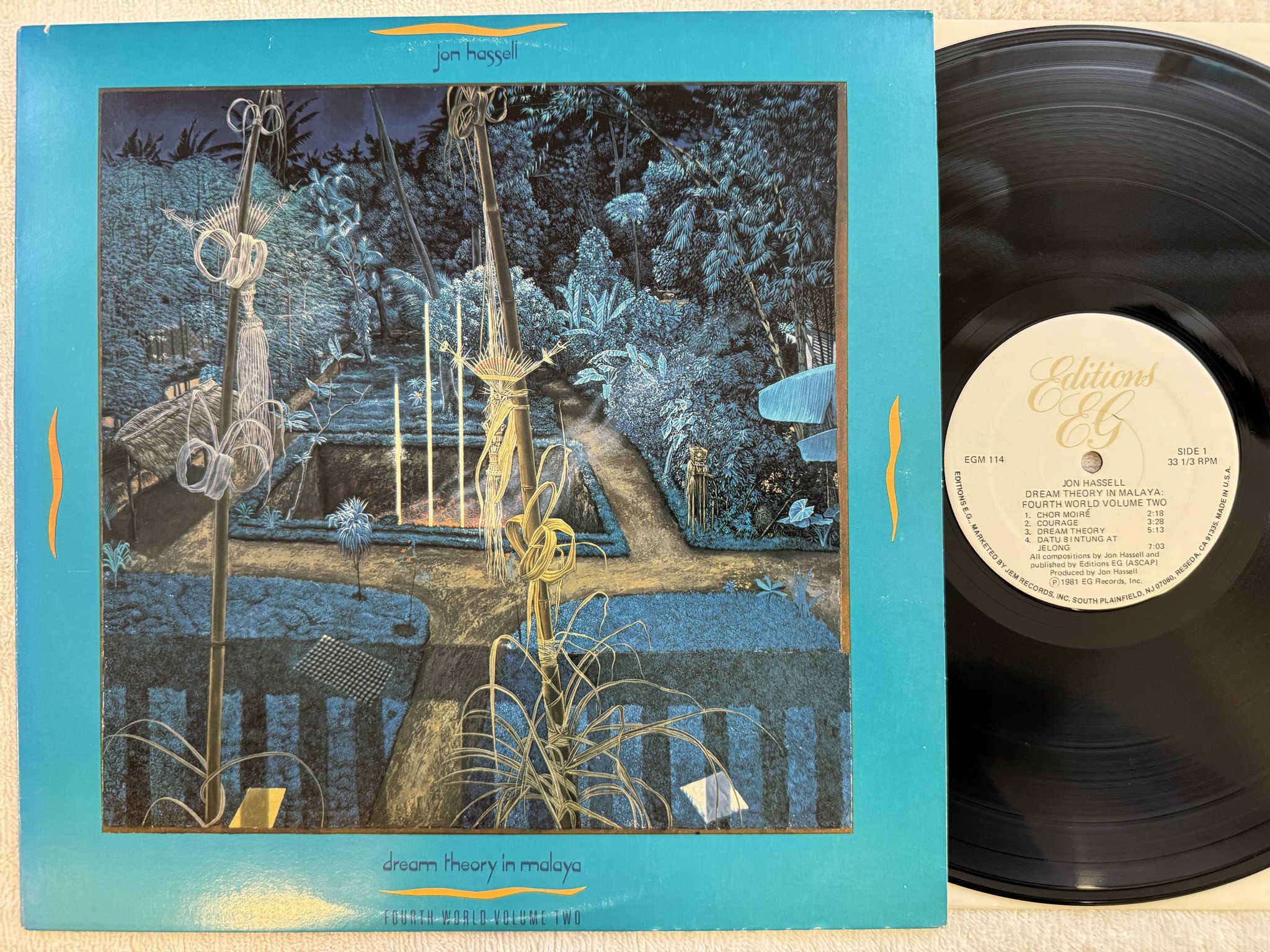 Omslagsbild för skivan JON HASSELL dream theory in Malaya LP -81 US EDITIONS EG EGM 114